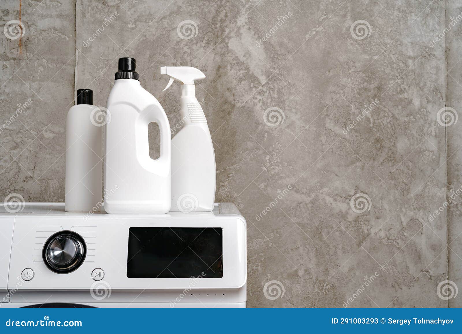 Washing Liquid Detergents on Washing Machine in a Laundry Room Stock