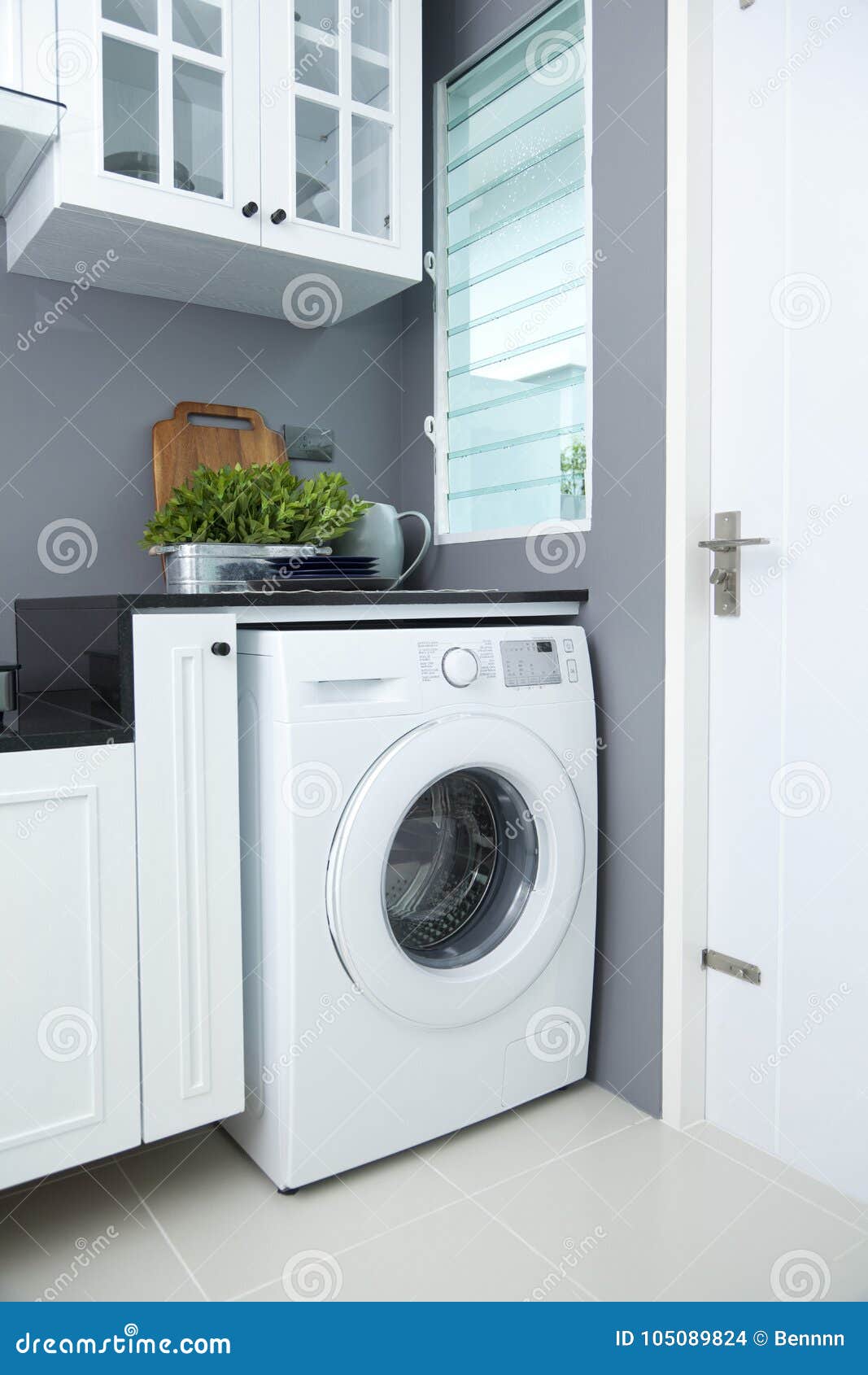 Washing machine in kitchen stock photo. Image of housework 105089824