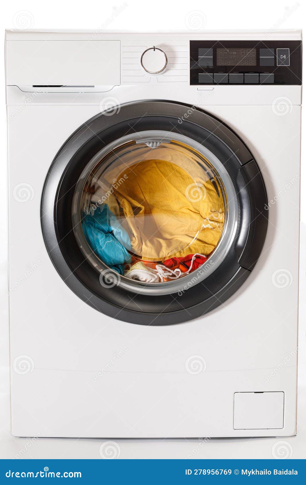 Washing Machine Loaded with Laundry before Washing. Closeup Stock