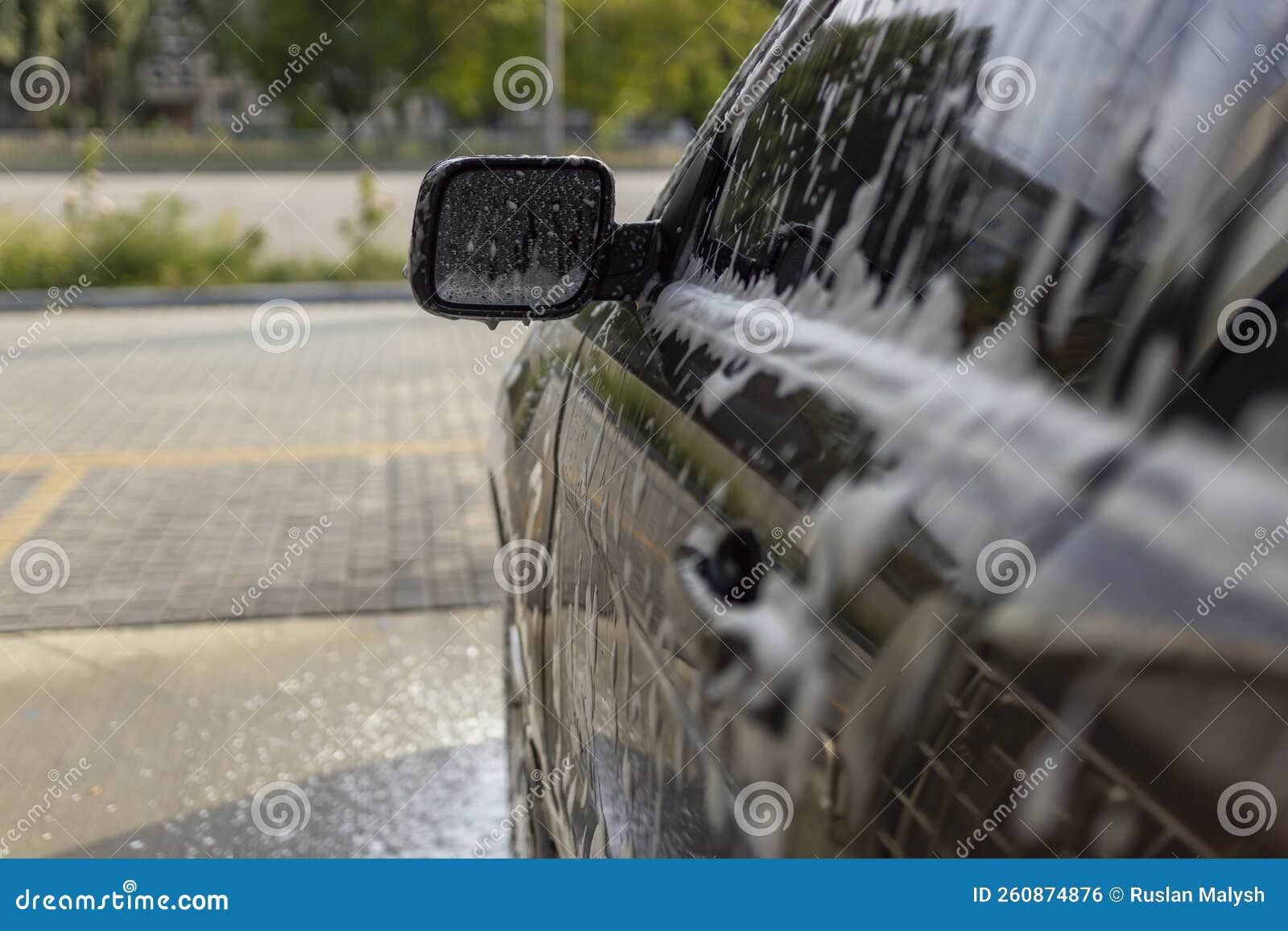 Washing Mirrors in a Car with Active Foam. Car Wash. Stock Photo