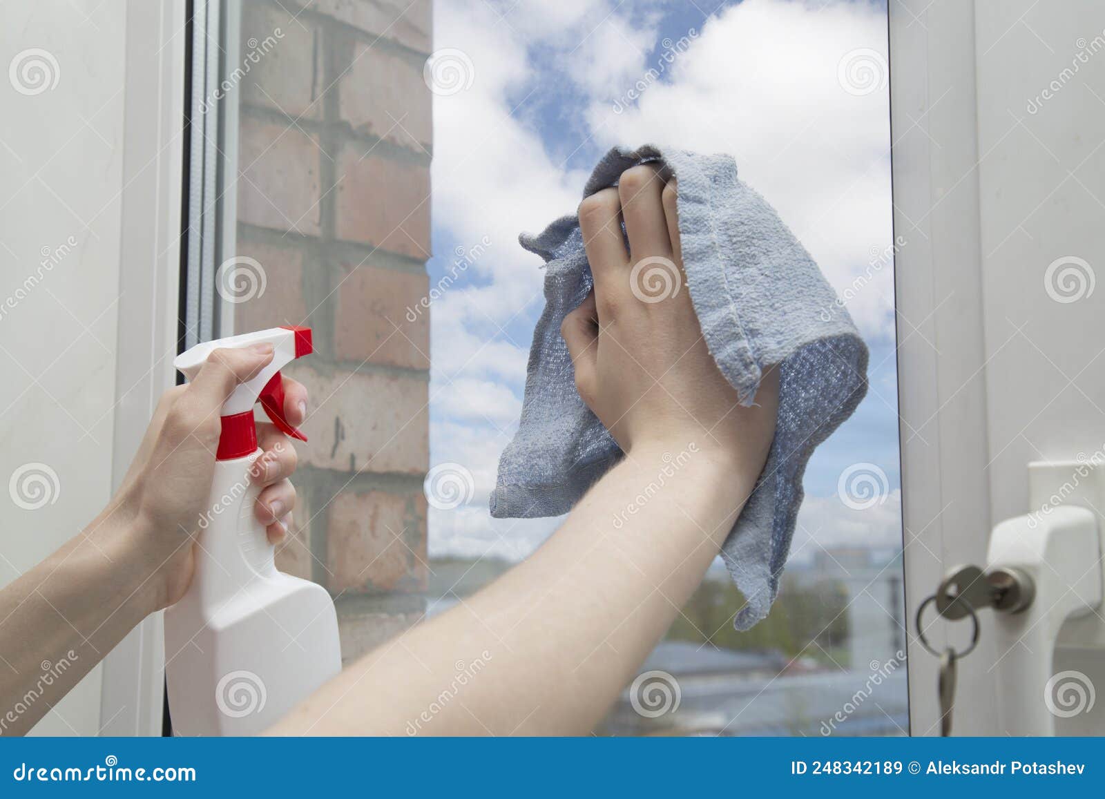 Washing the Windows of the House with Cleaning Agents Stock Image
