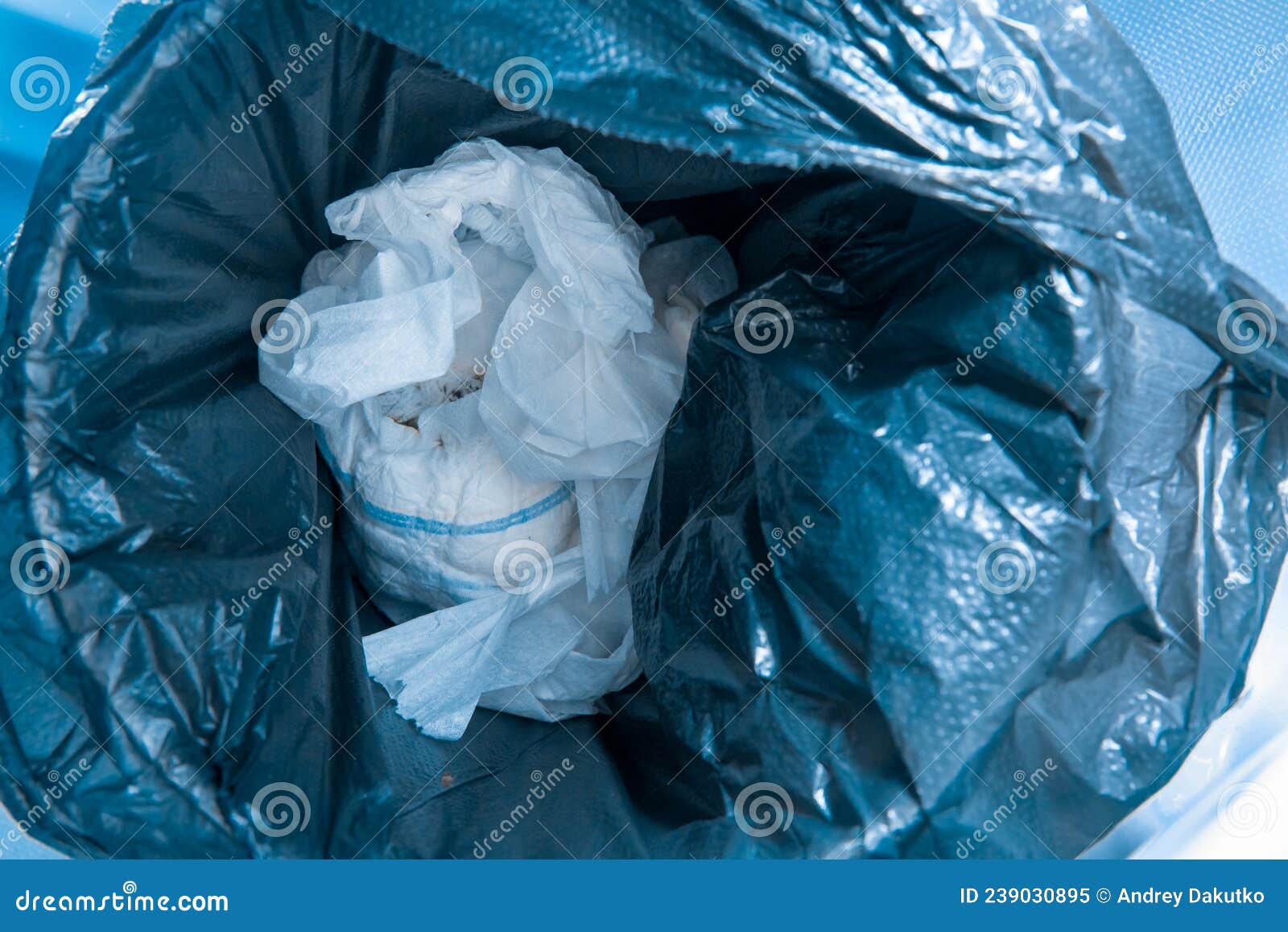 Waste Used Children`s Dirty Diaper Garbage in the Trash Bin Stock Image