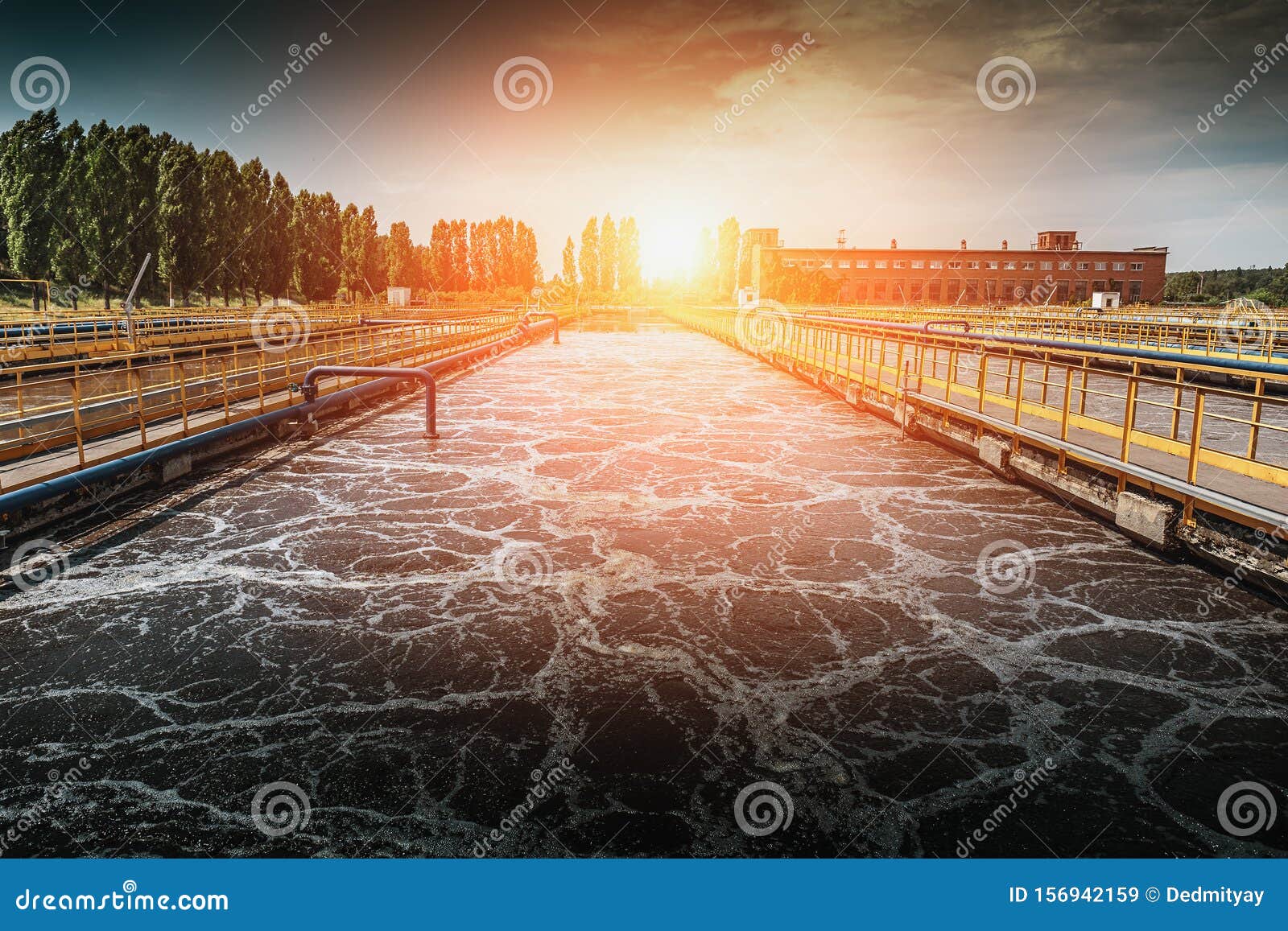 wastewater treatment plant at sunset. tanks for aeration and cleaning of sewage mass