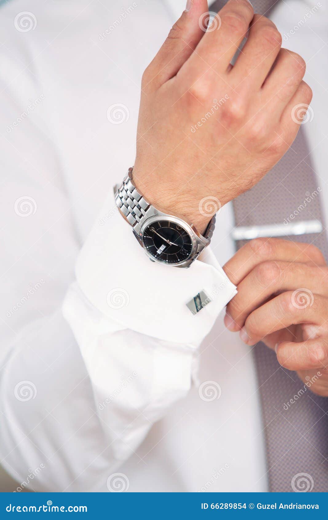 Watch on a hand at the man stock photo. Image of black 66289854