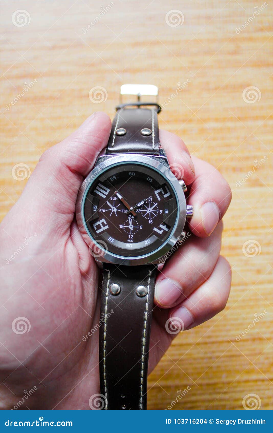 Clock in hand for timing stock photo. Image of counting 103716204