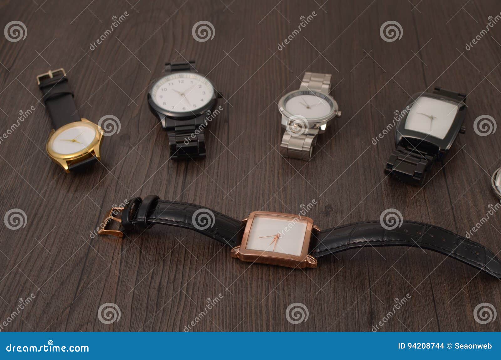 Watch on a wooden floor stock photo. Image of checking - 94208744