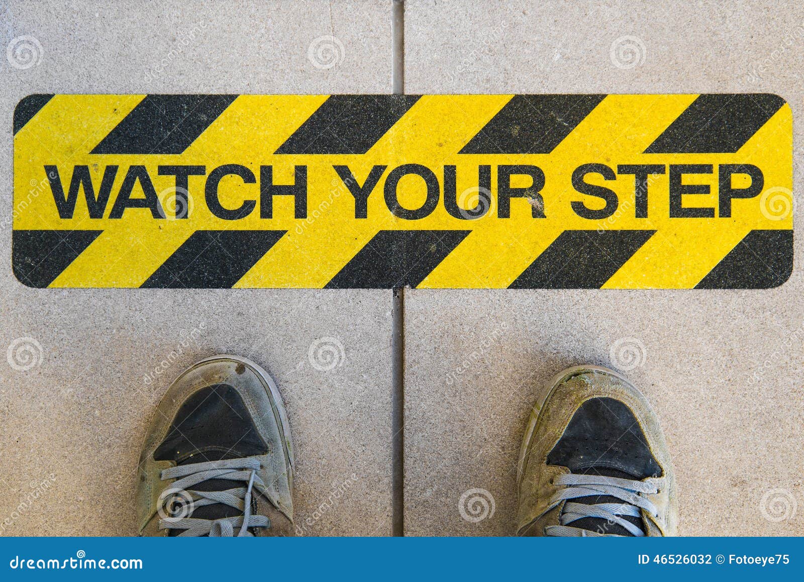 Watch Your Step Sign On A Staircase And A Pair Of Feet Stock Photo ...