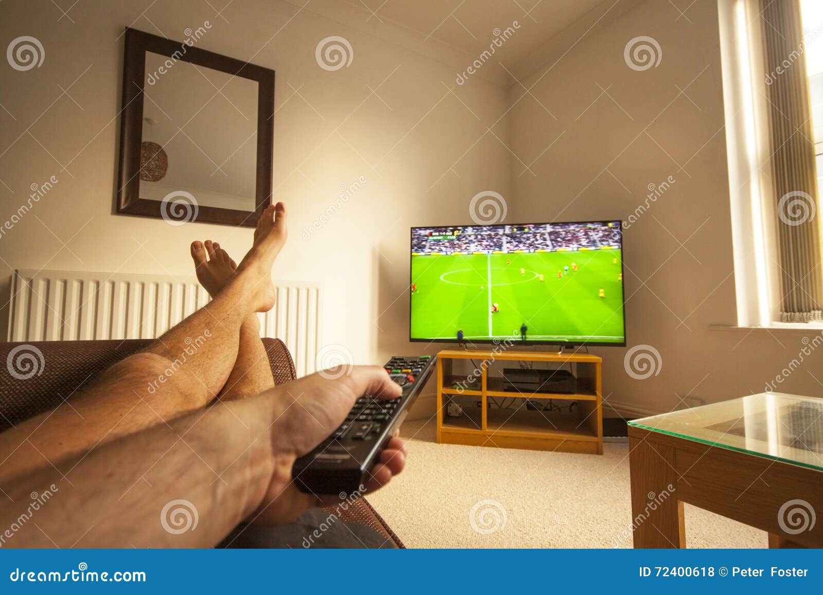 Watching Football on TV stock photo