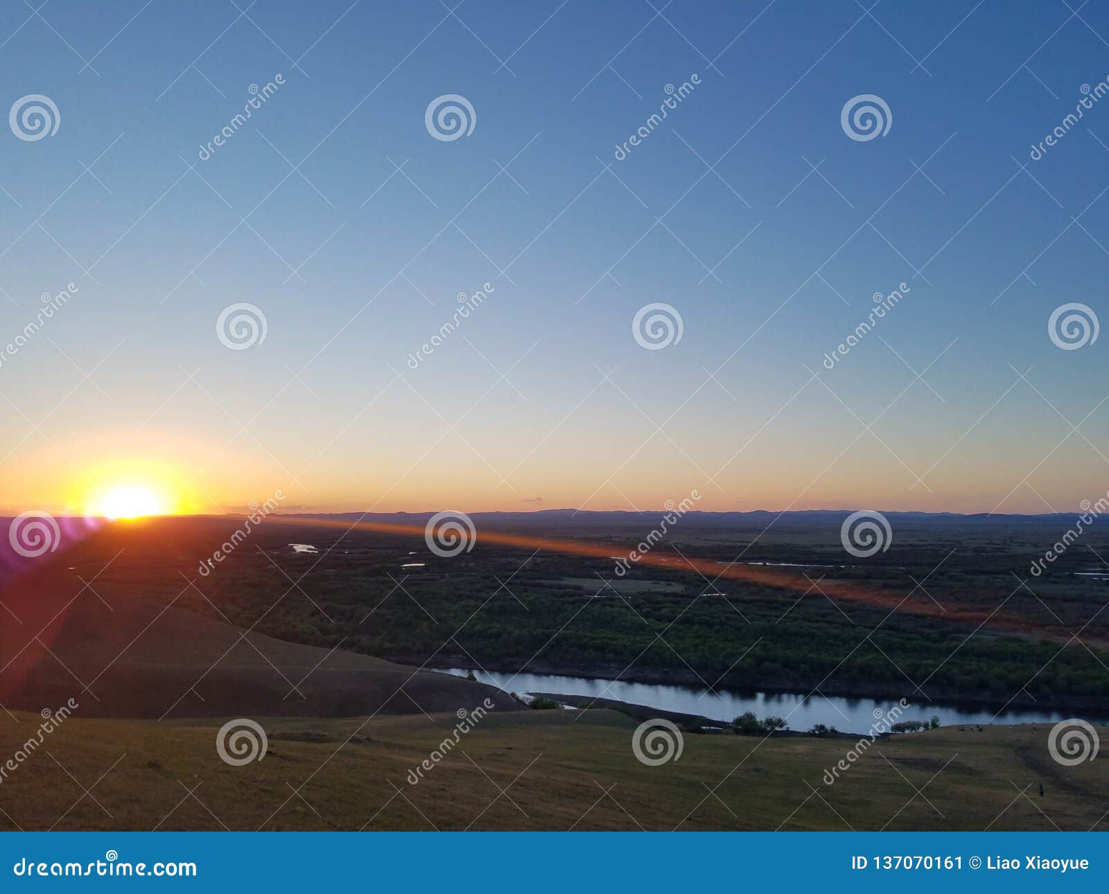 watching sunrise in hulun buir grassland