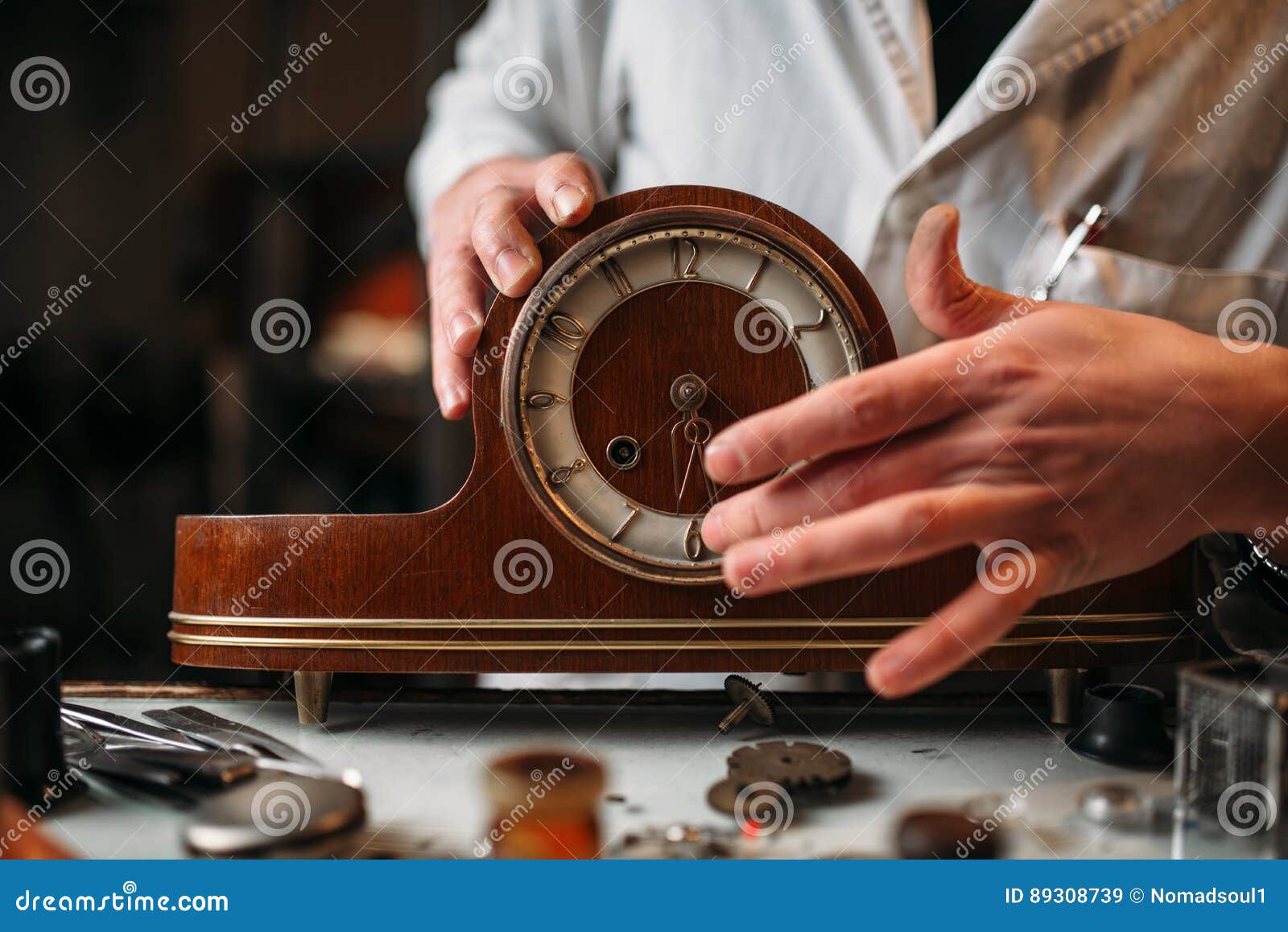 watchmaker restore old wooden table clock