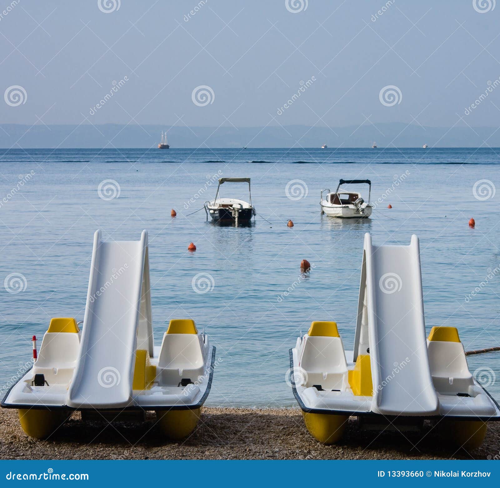 Water bikes on the beach stock photo. Image of tourism 13393660