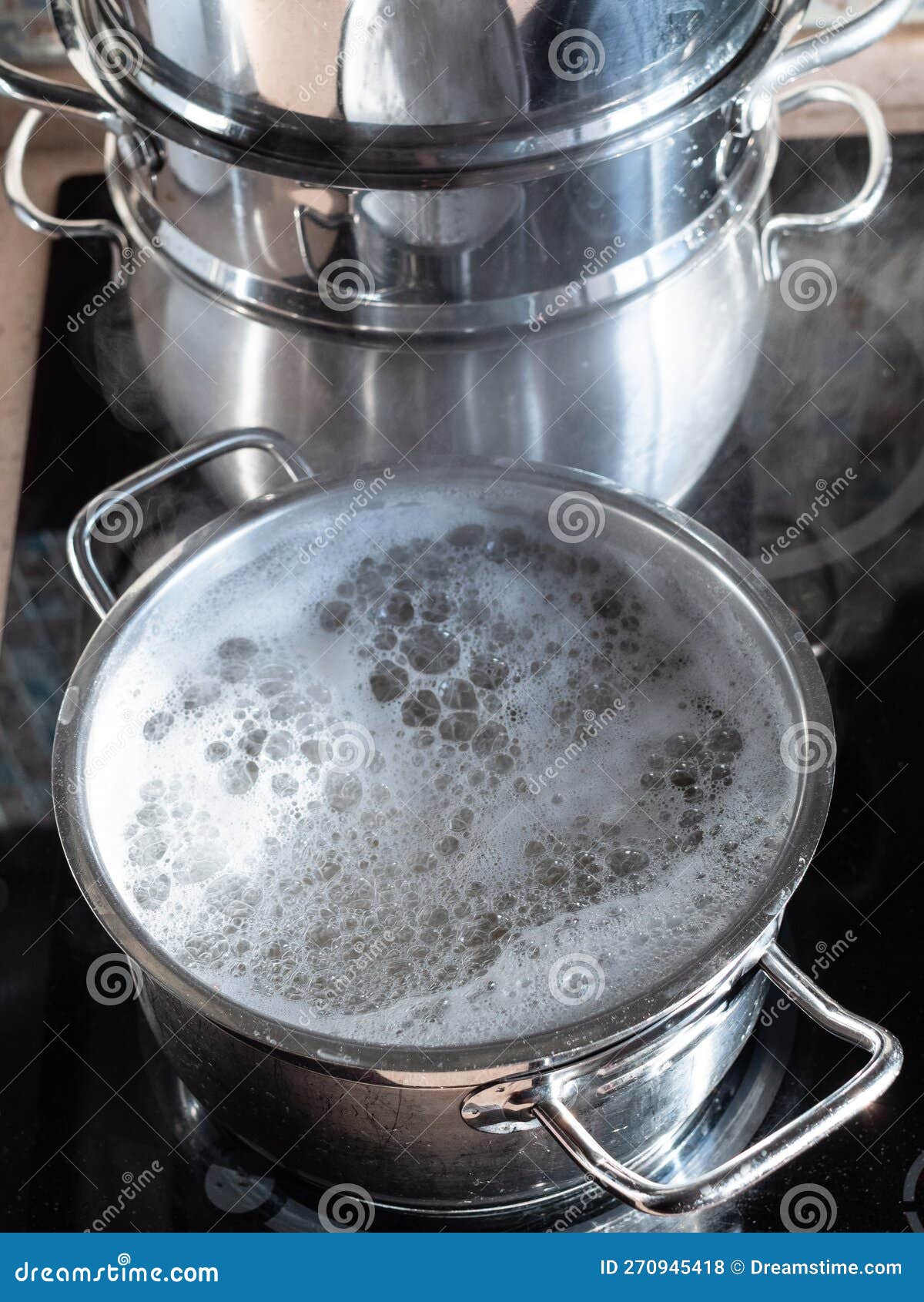 Water Boils in Saucepan on Ceramic Stove at Home Stock Photo Image of