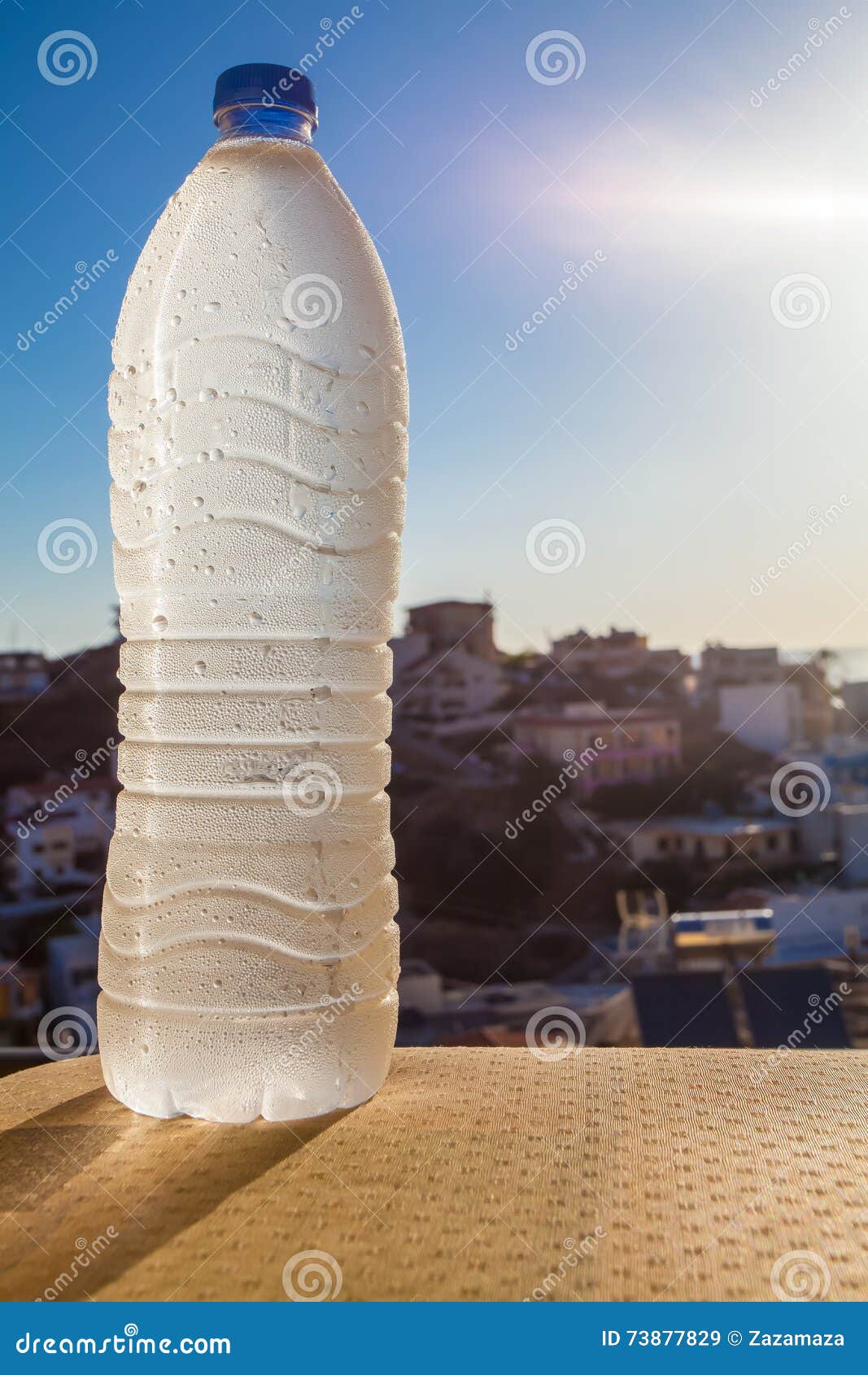 Water Bottle Full of Water with Drops on Bright Sunlight. Stock Image