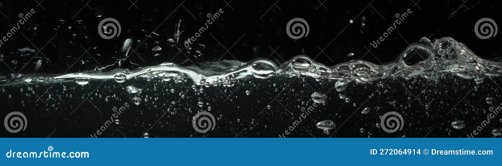 Water with Bubbles in Aquarium Against Dark Background Stock Photo