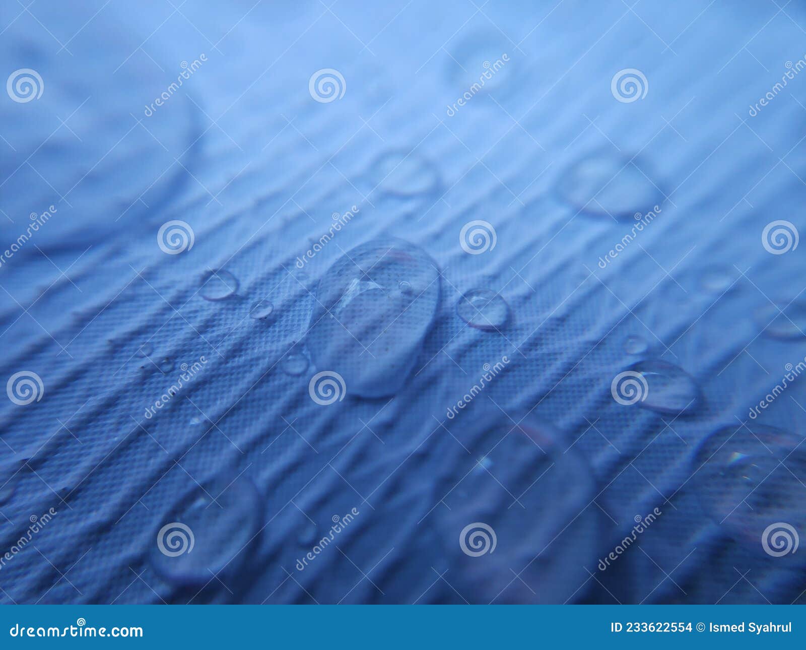 Water Drop on Fabric Textured Surface. Stock Photo Image of science
