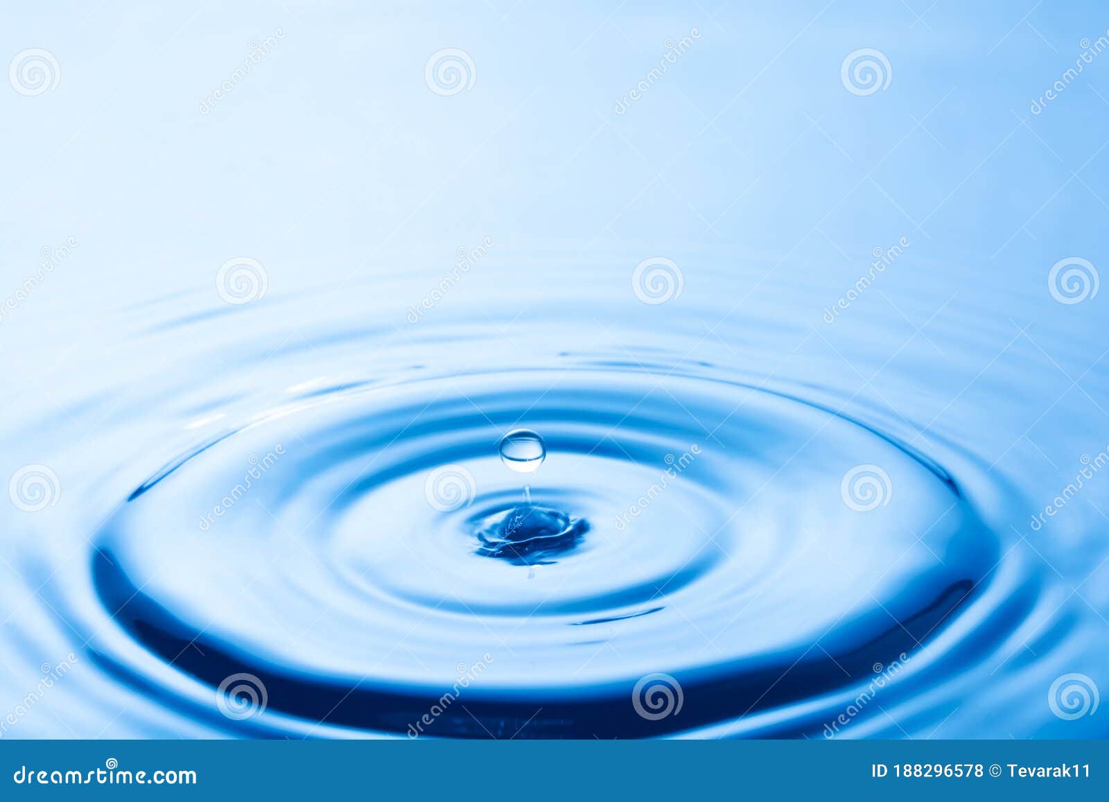 Water Droplet Falling Impact with Water Surface. Causing Rings on Water