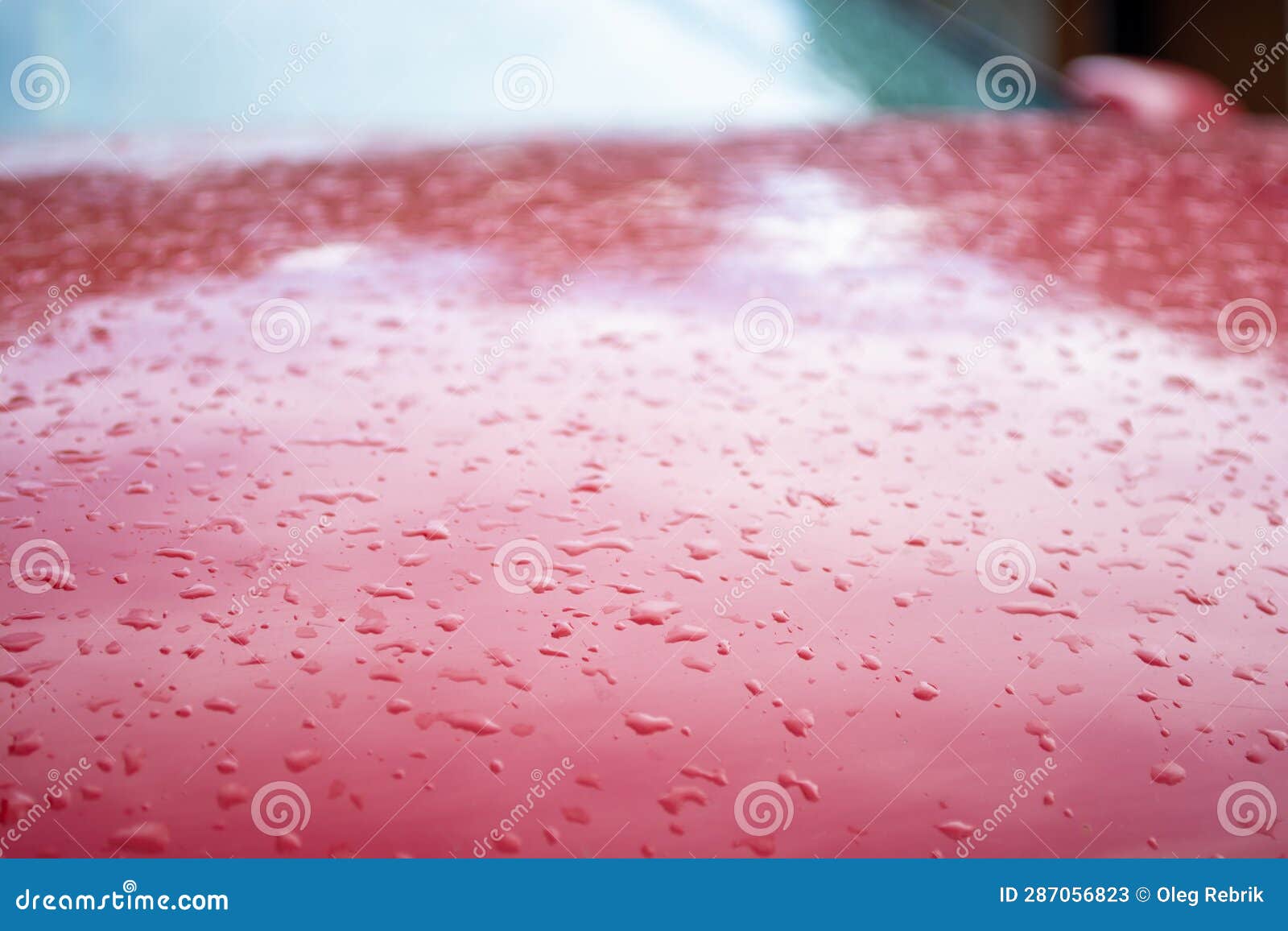 water drops on red car, shallow depth of field, selective focus