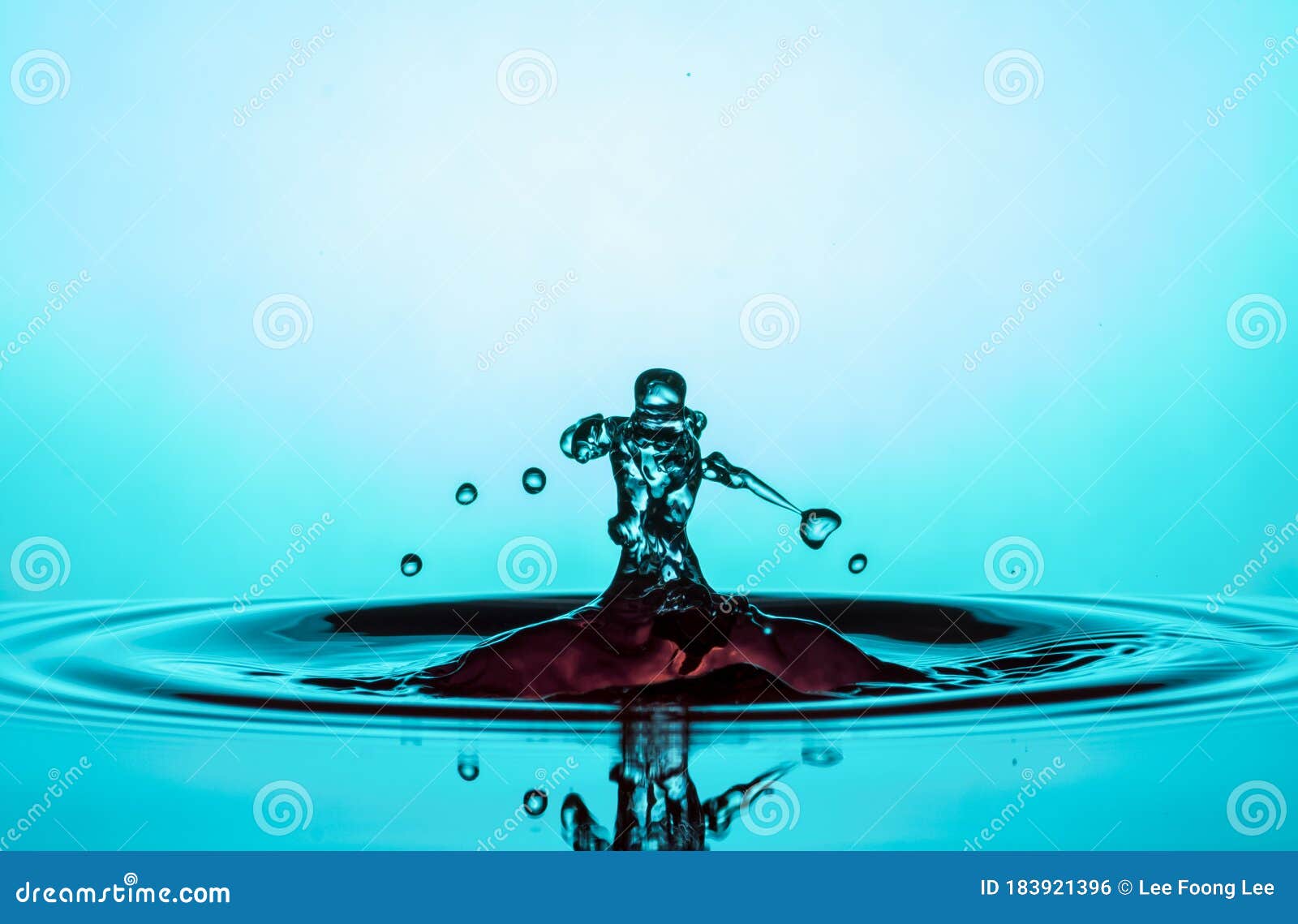 Water Drop Collisions Macro Photography with blue background