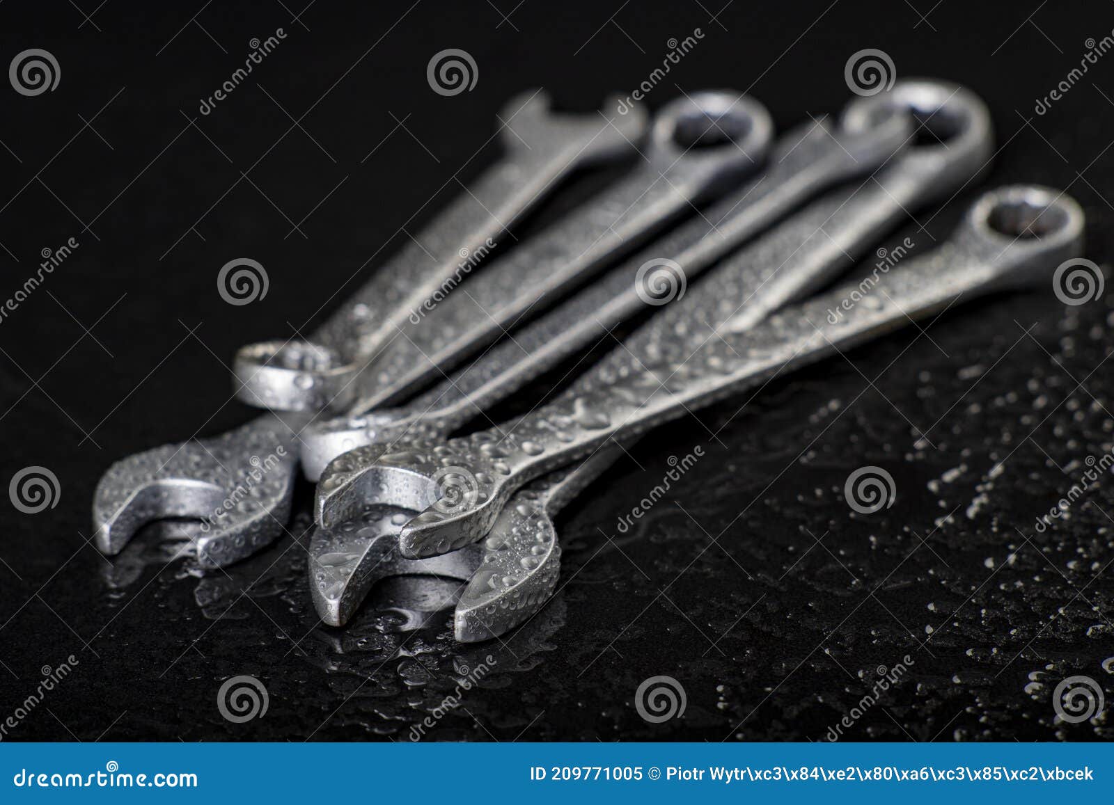 water drops on workshop wrenches. wet tools used in a machine shop