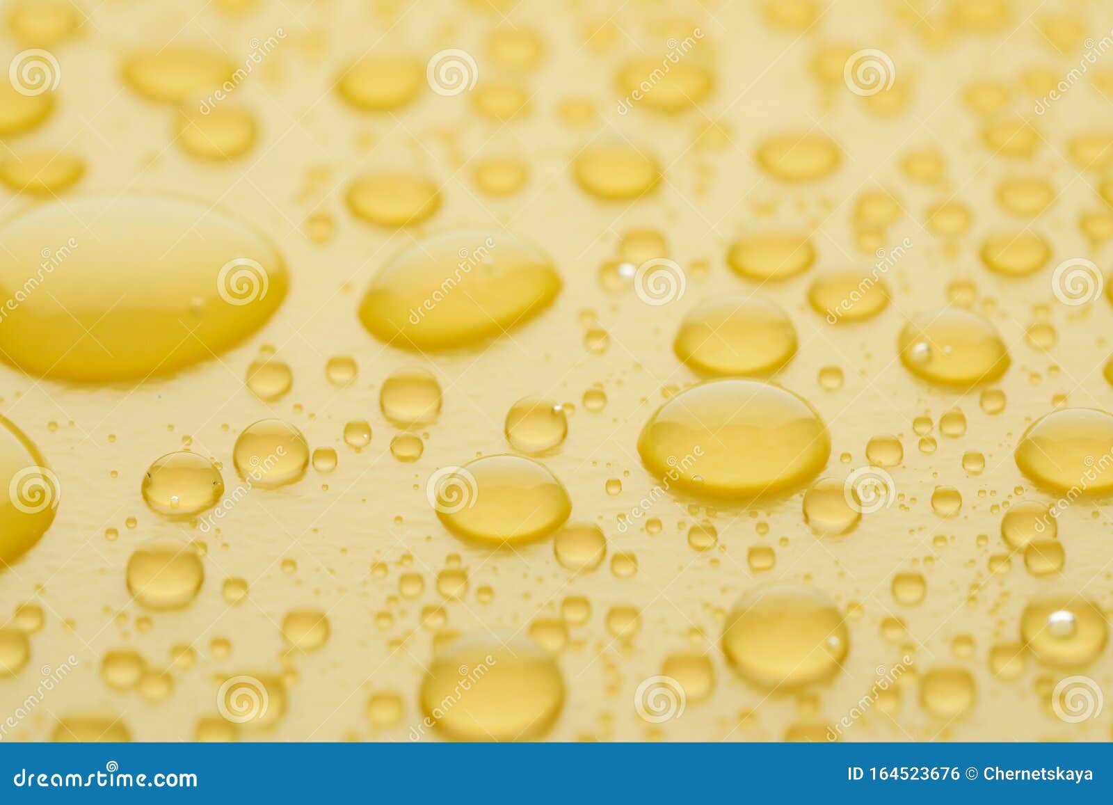 Water Drops on Yellow Background, Closeup Stock Photo Image of view