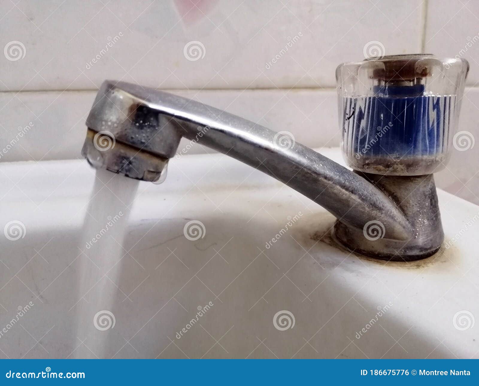 The Water Faucet is Left Open. Water Flows Out of the Tap, Water in the