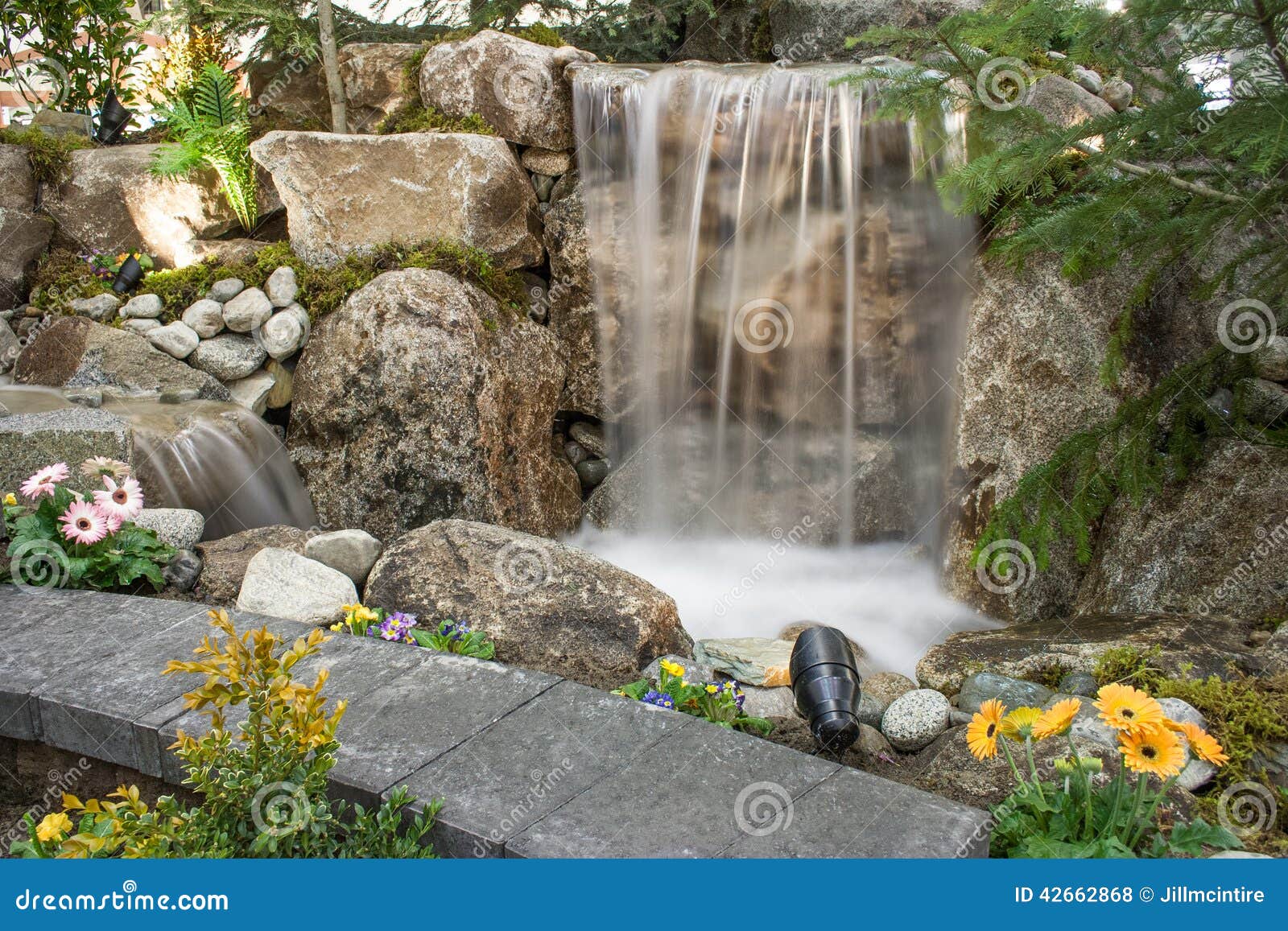 water feature with pond and flowers