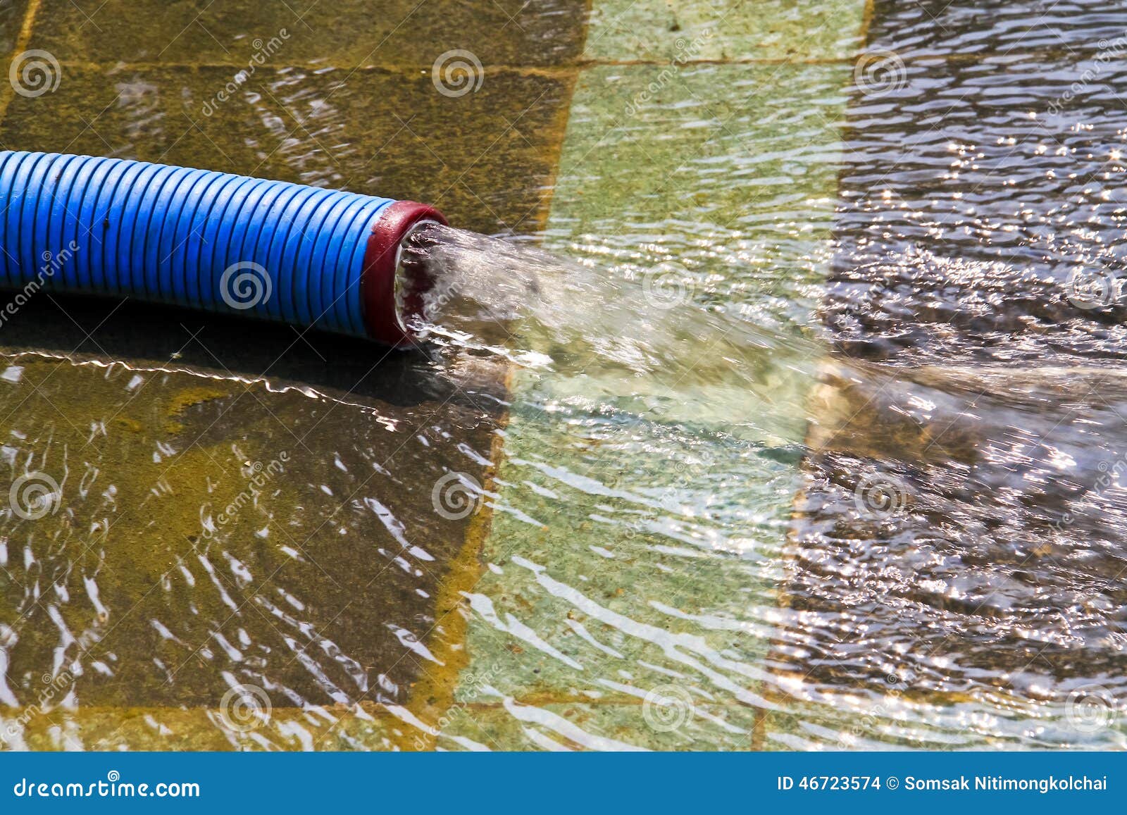 Water Flowing Out Of The Pipe Spread On The Concrete Floor Stock Photo