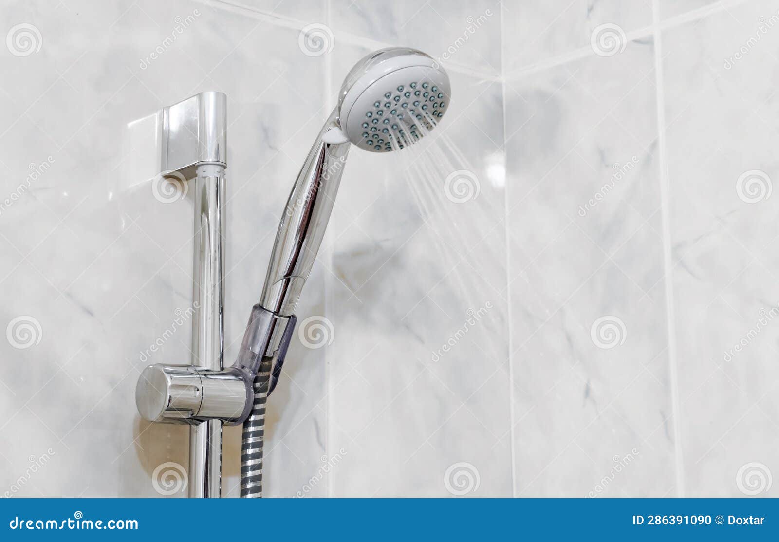 Water Flowing from Shower in the Bathroom Interior Close Up View Stock