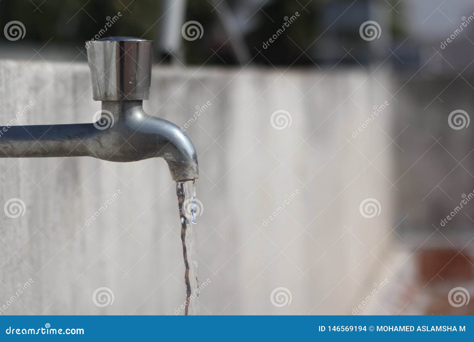 Water flowing from tap stock photo