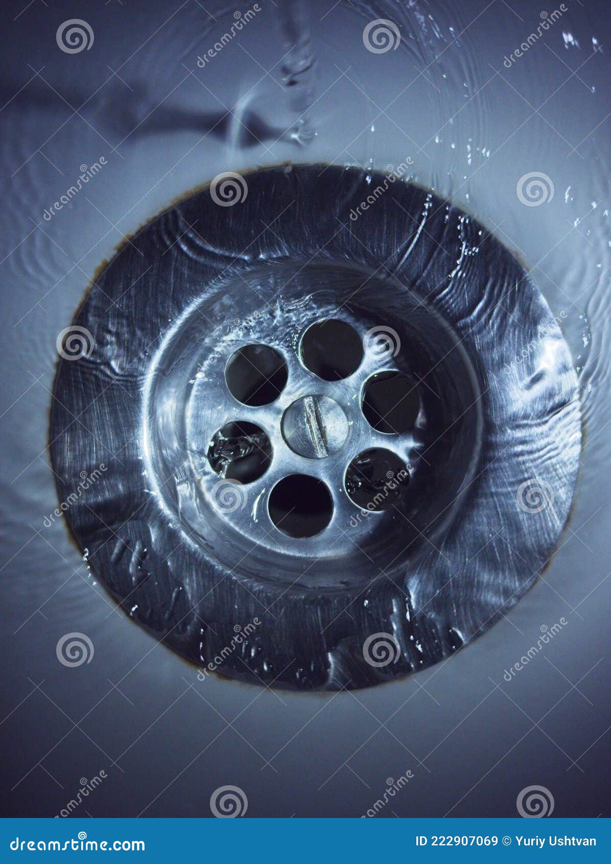 Water going down the sink stock image. Image of water 222907069