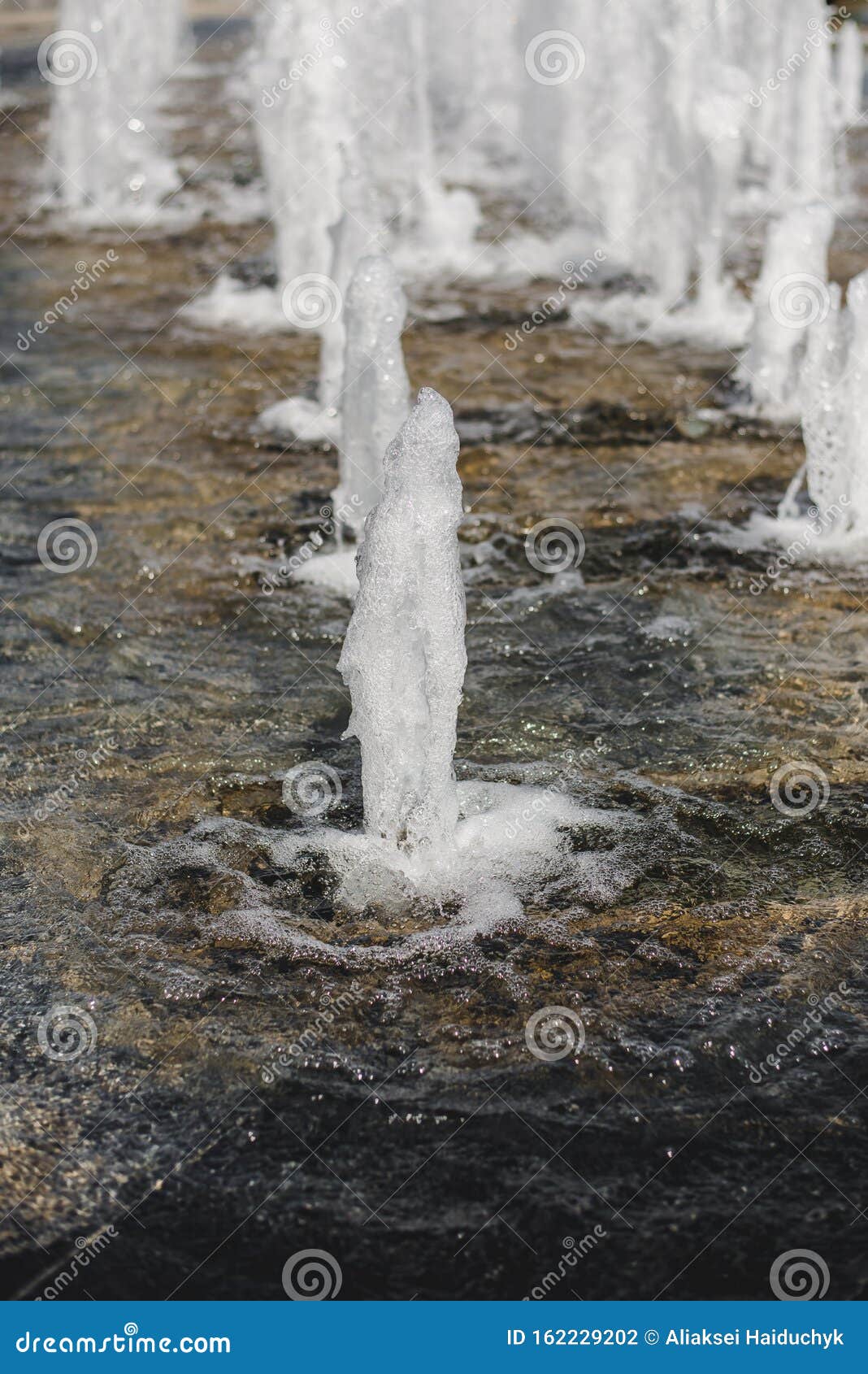 Water Gushing From The Groundwater Pressure City Fountain Jet Bottom