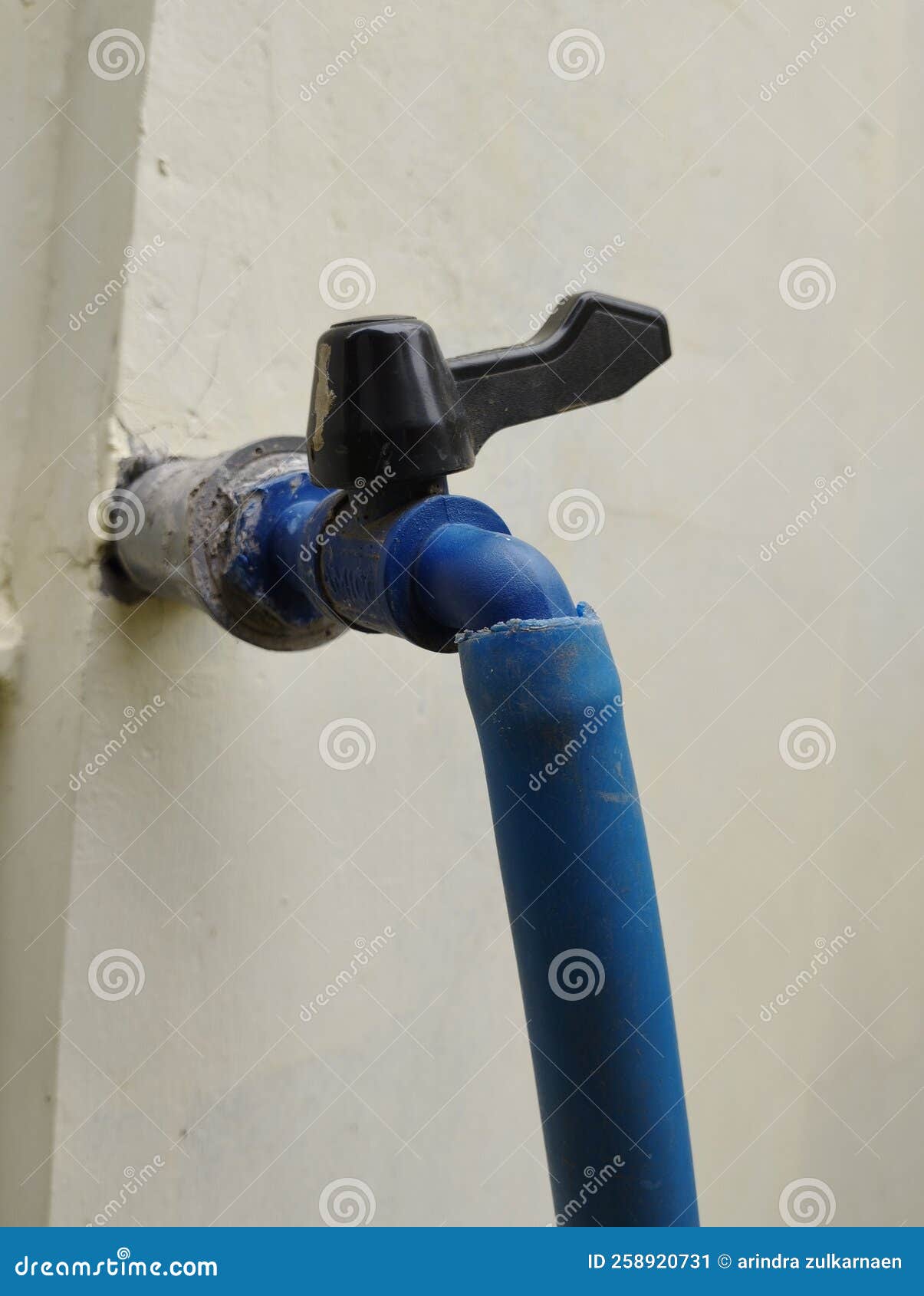 Water hose and faucet stock image. Image of purple, wood 258920731