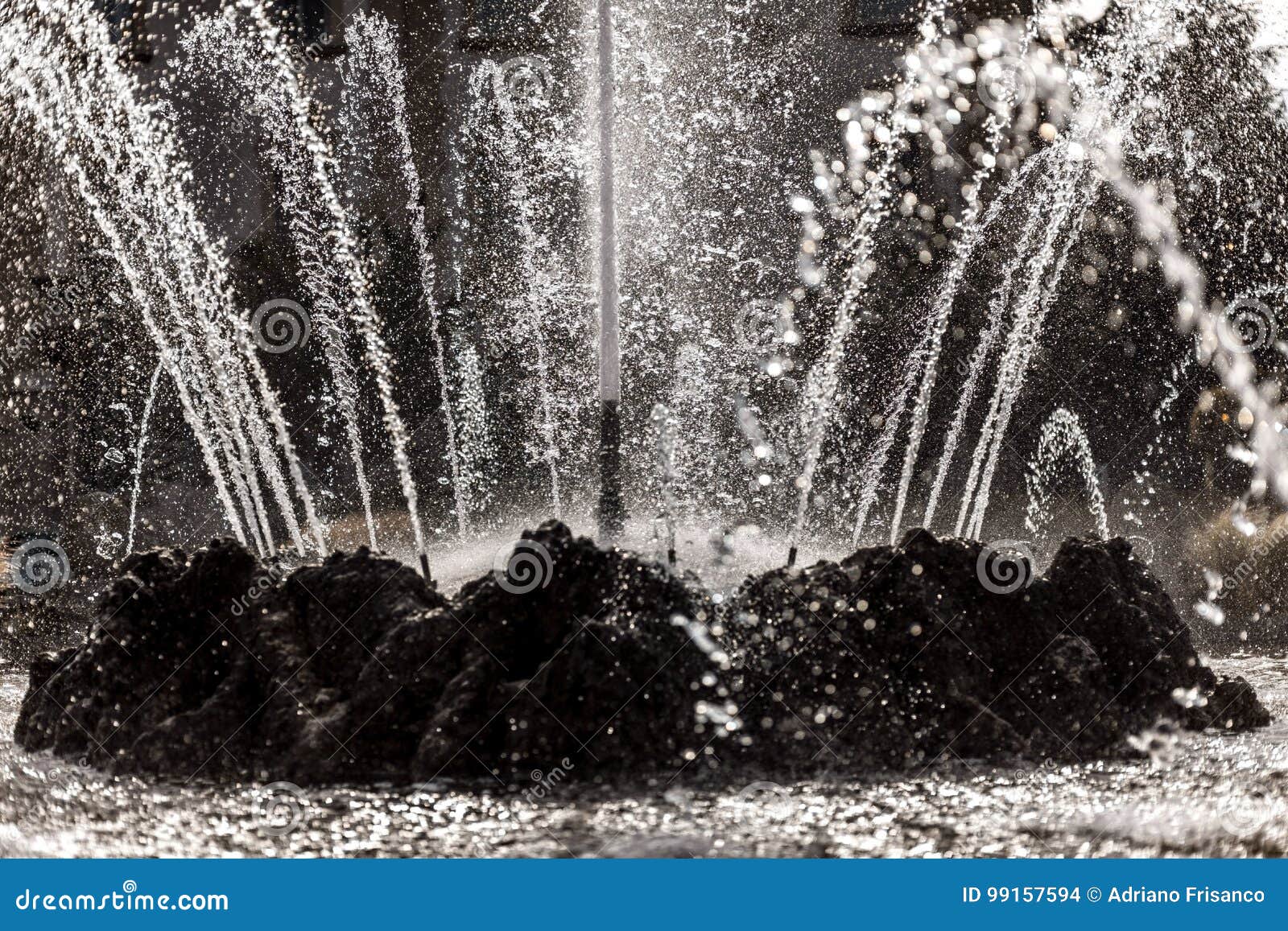 Water jets of a fountain stock photo. Image of black 99157594