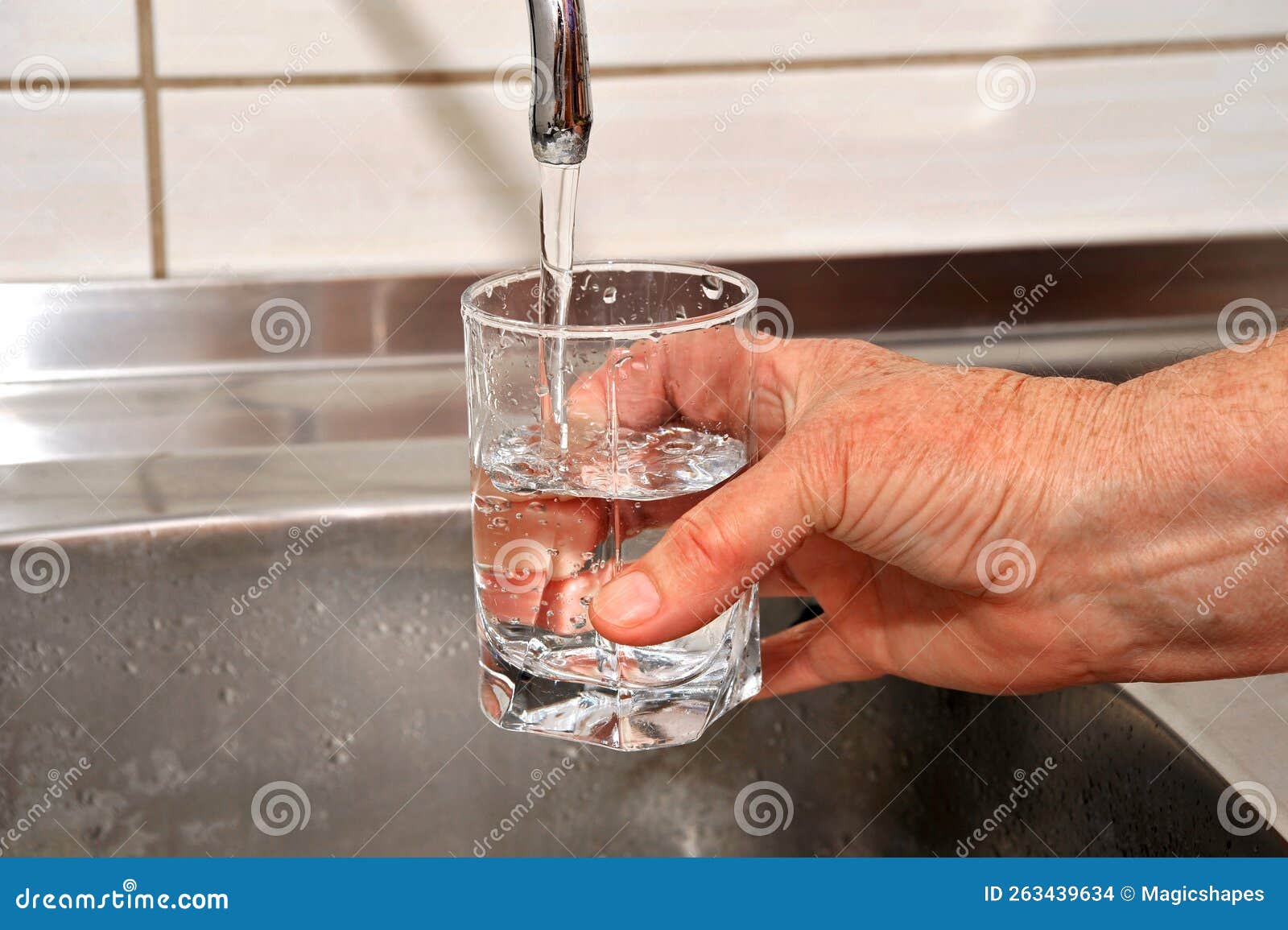 Water from the kitchen tap stock photo. Image of colored 263439634