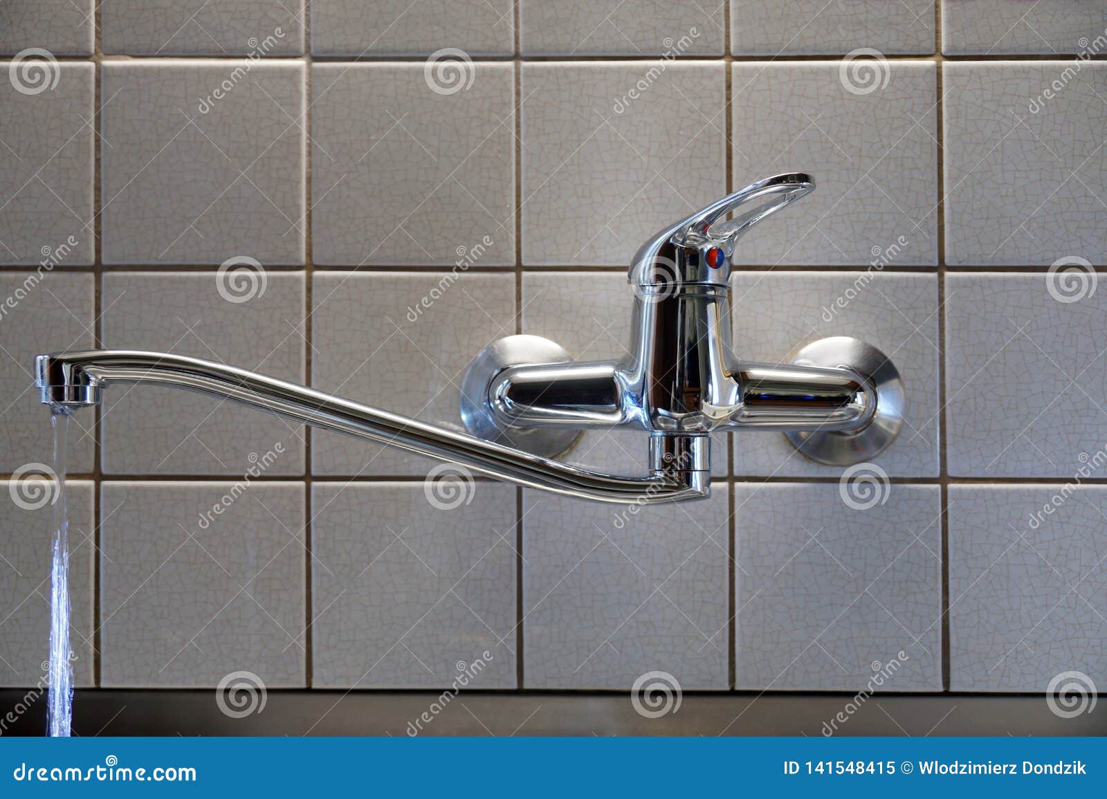 Water Leaking from the Tap with a Damaged Gasket. a Tap in the Kitchen