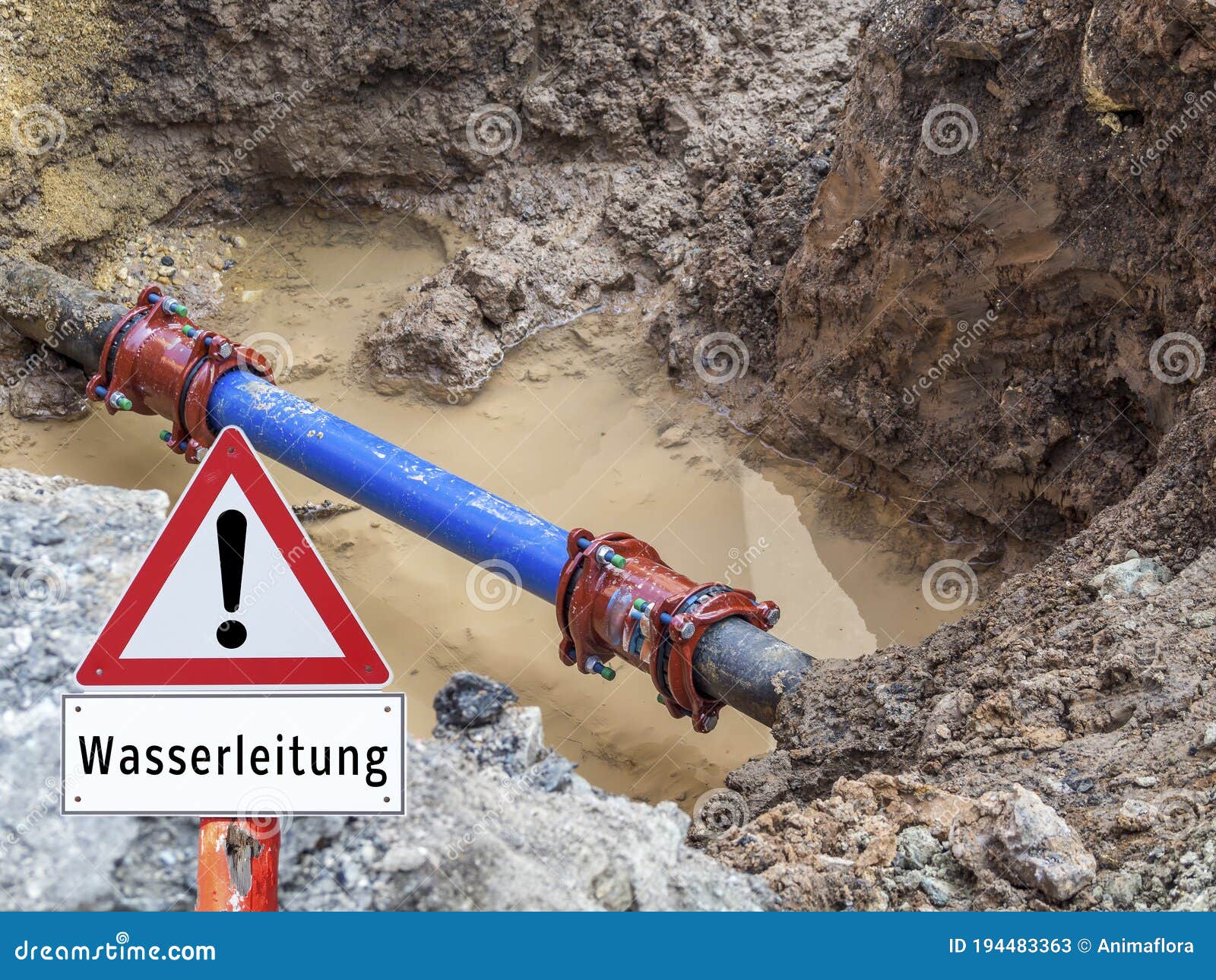 Water Pipe Burst Warning Sign in German Stock Image Image of leakage