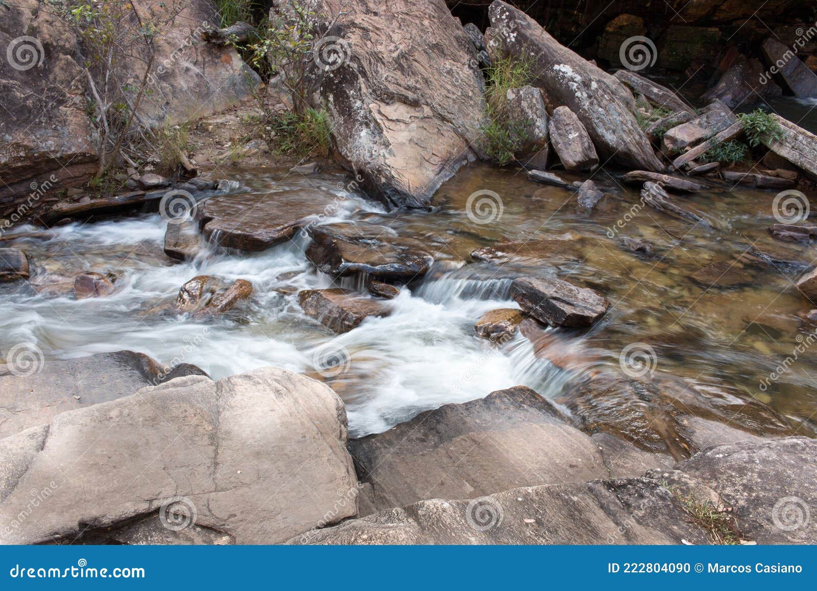 water rushing down the small river at waterfall old mill or chachoeira da usina velha