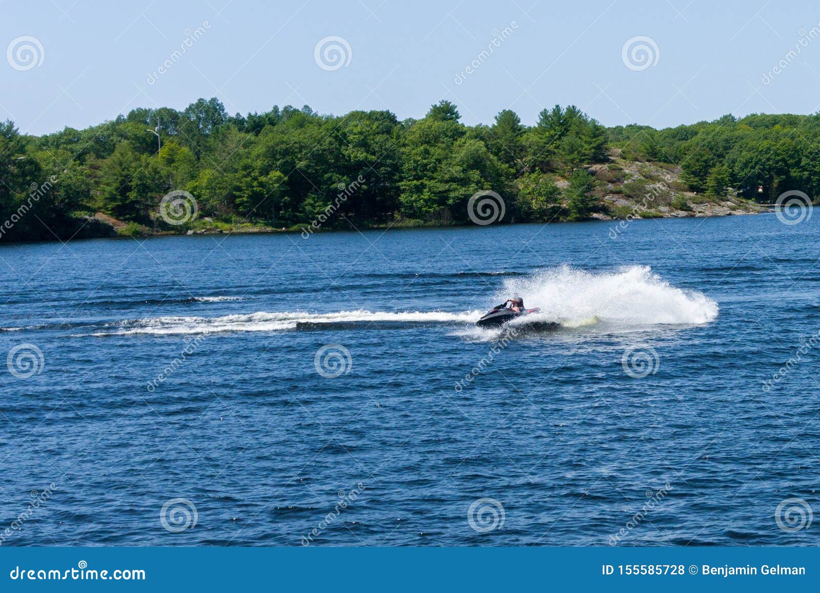 On a Water Scooter on a Blue Lake Stock Photo Image of happy, watercraft 155585728