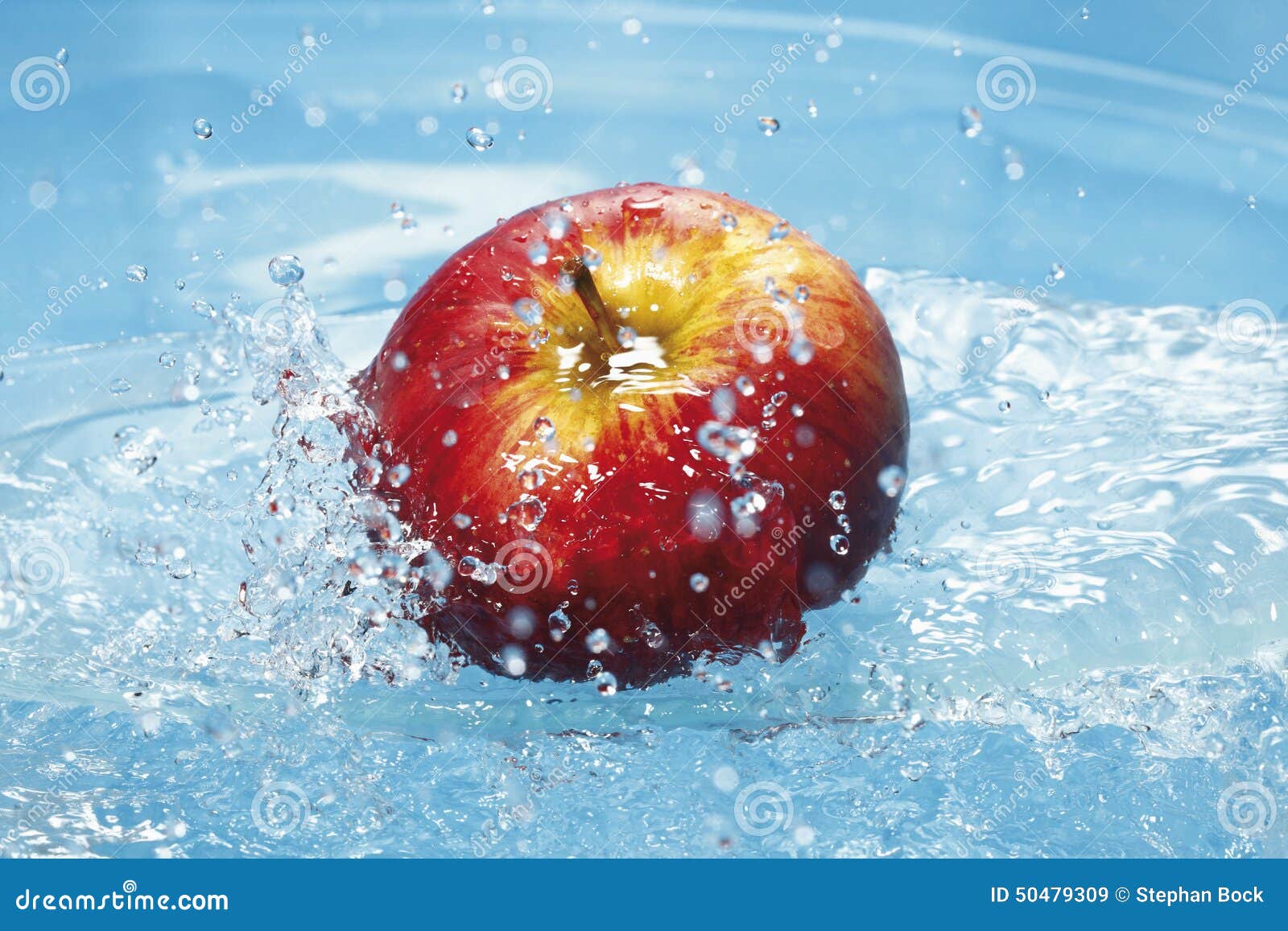 Water Splashing on Fresh Red Apple Stock Image Image of blue, ripple 50479309