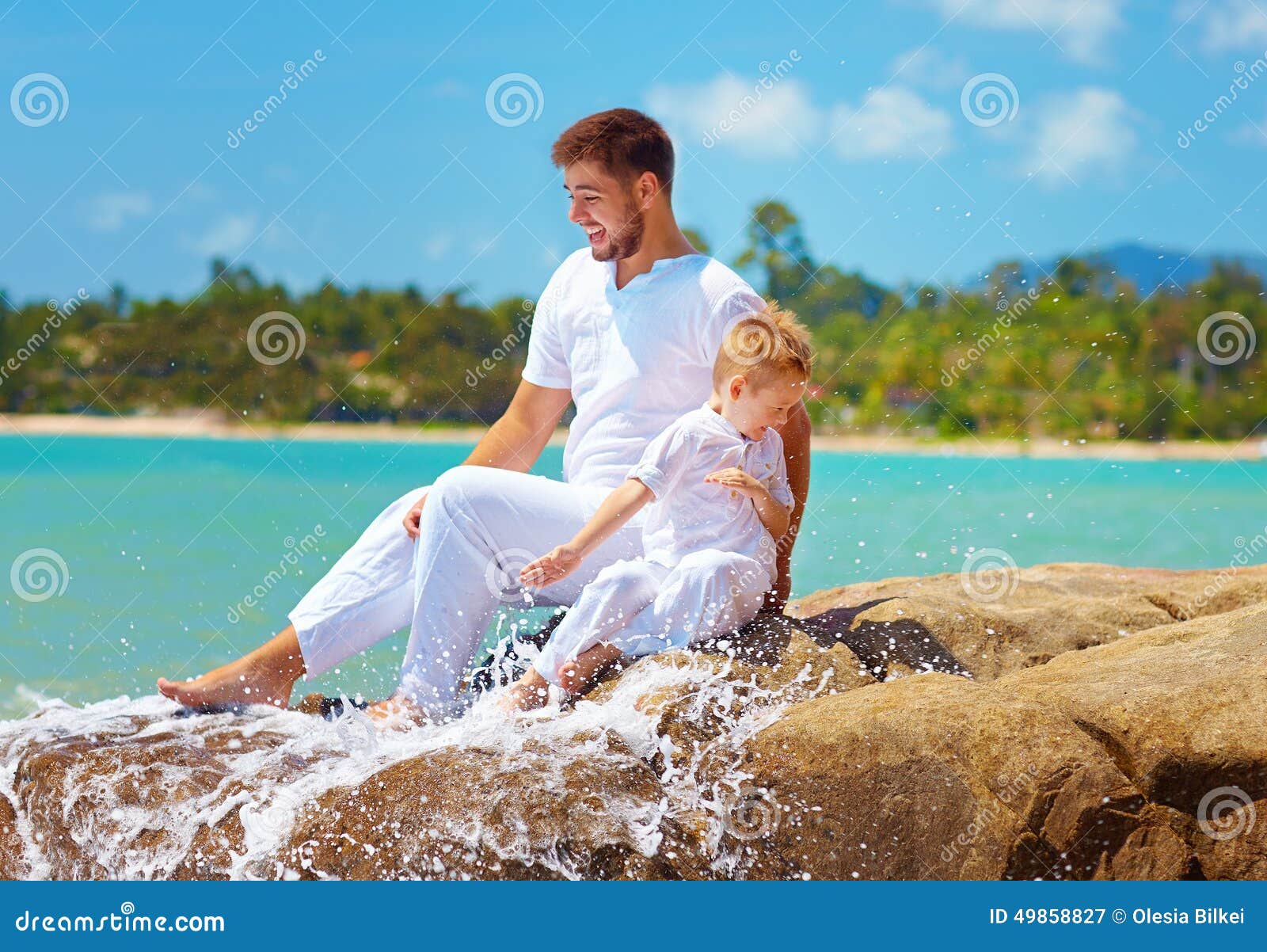 Water Splashing on Happy Father and Son on Vacation Stock Image Image