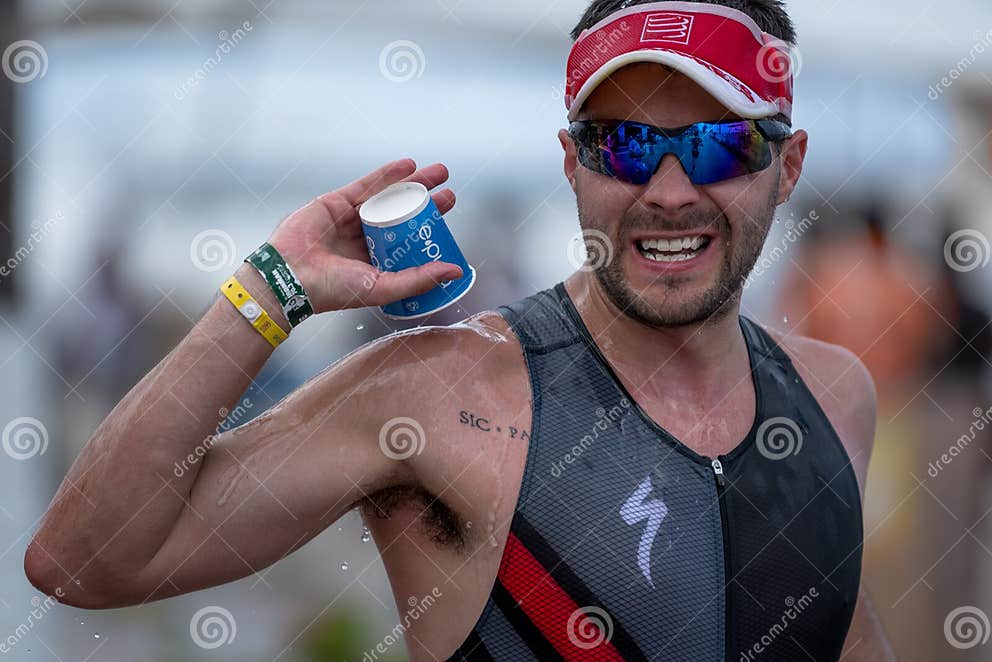 Water Station with Runners at the Cozumel Half Ironman 2017 Editorial