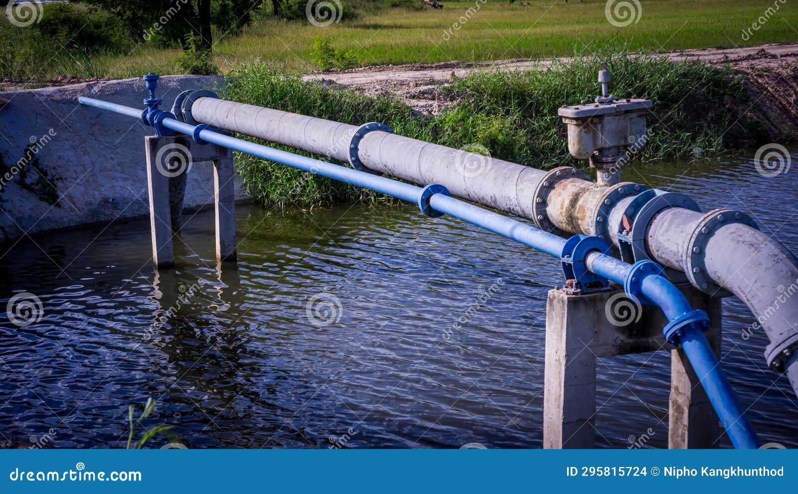 Water Supply Pipeline System, Which Runs through Waterfilled Canals, in Rural Areas Stock Photo