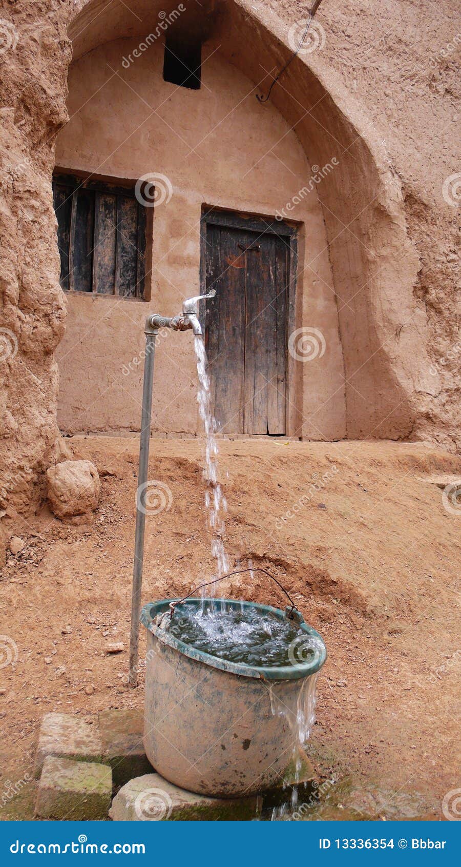 Water Tap And Cave Dwellings Stock Photo Image of earth 