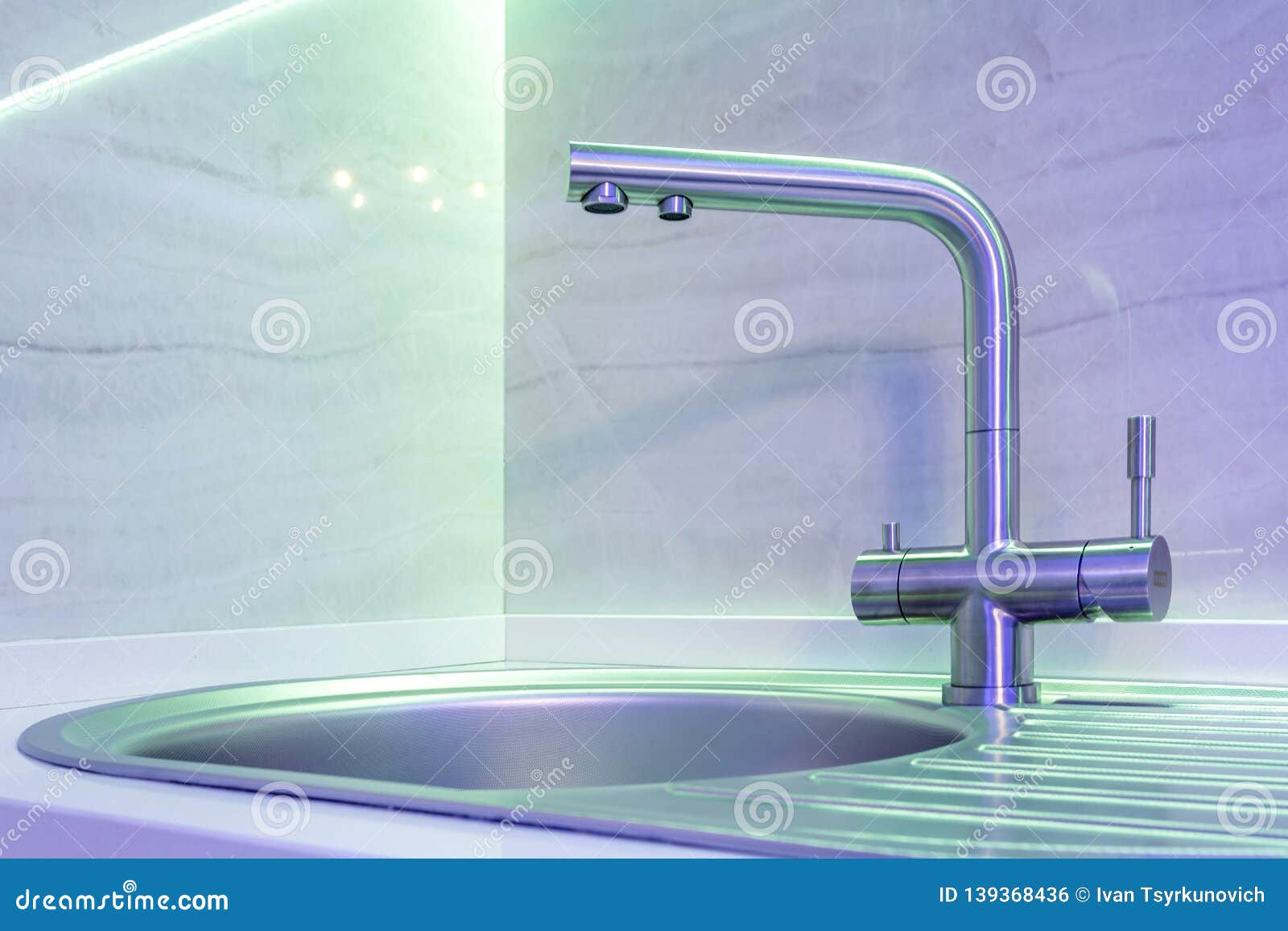 Water Tap Sink With Faucet In Expensive Loft Kitchen In Neon Light