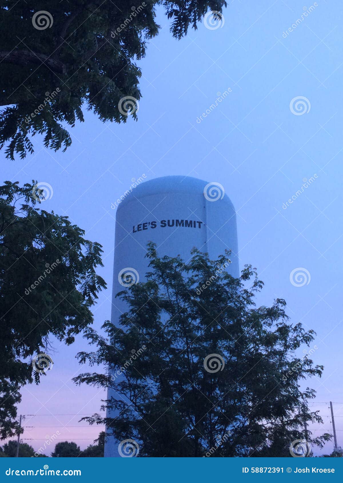 Water tower at sunset stock image. Image of trees, sunset - 58872391