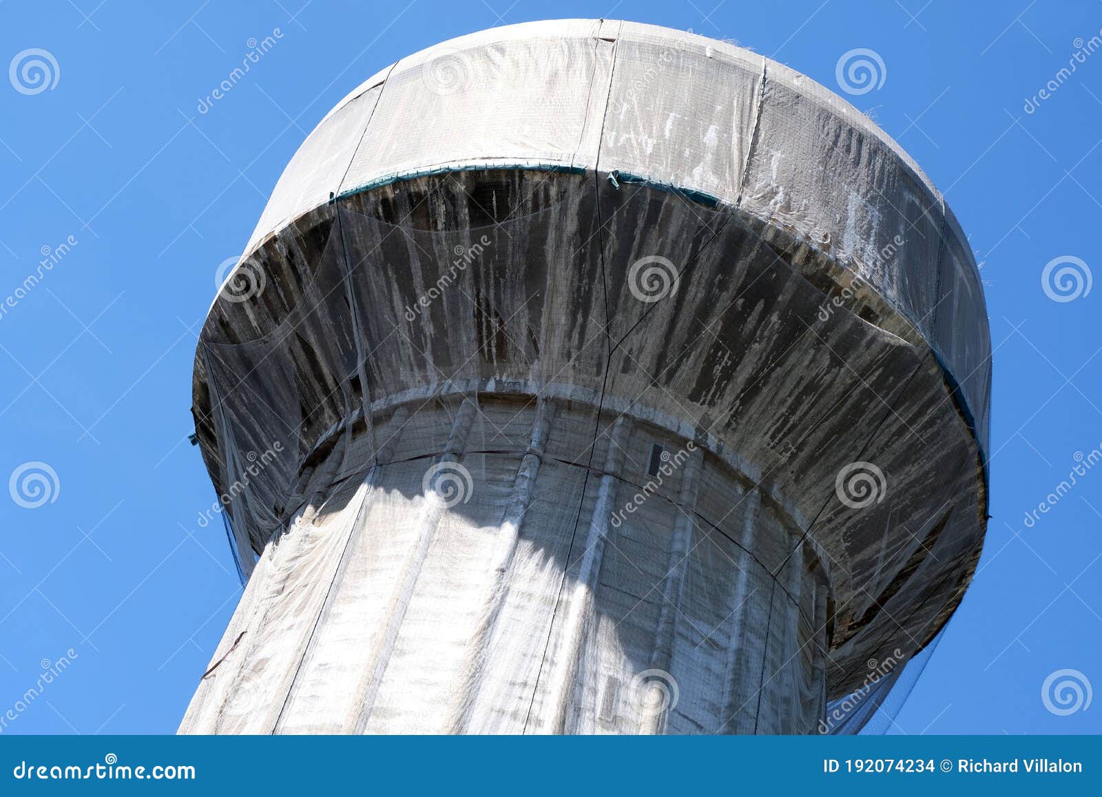 water tower surrounded by a protective net