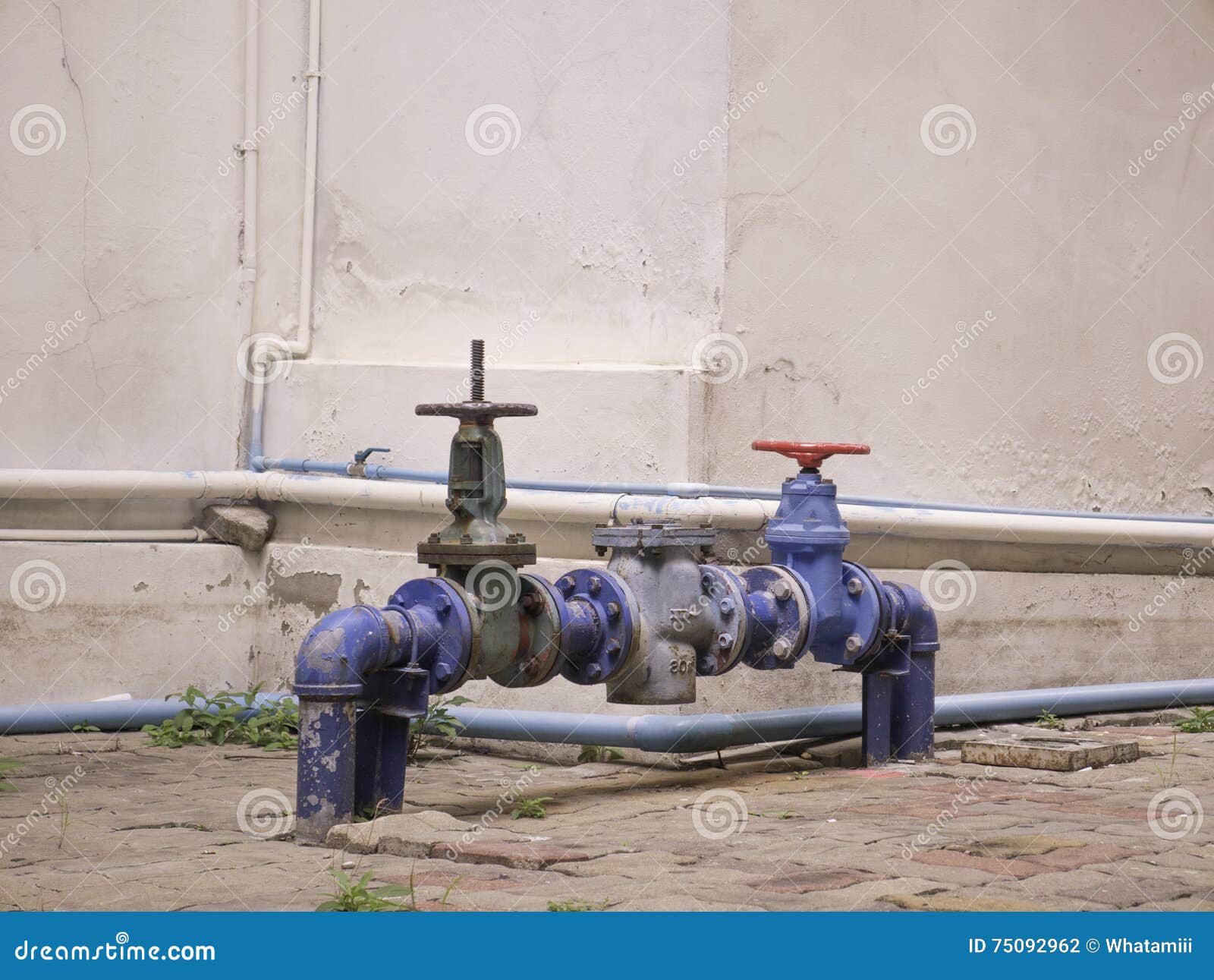 Water valve near building stock photo. Image of circle 75092962