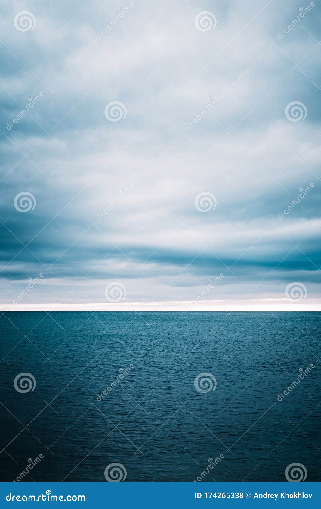 water waves on cloudy sky background