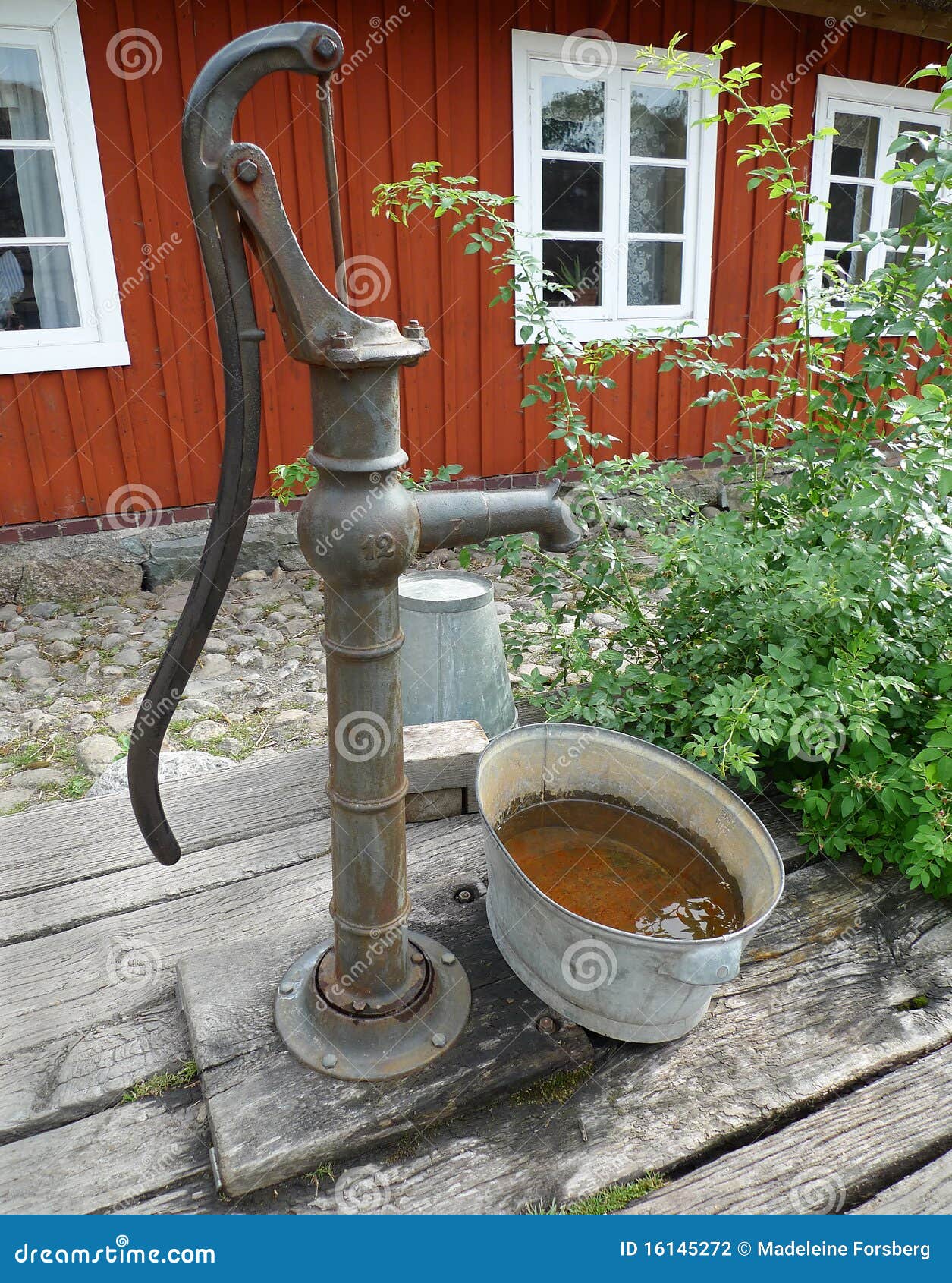 Water well pump stock photo. Image of historical, grass 16145272
