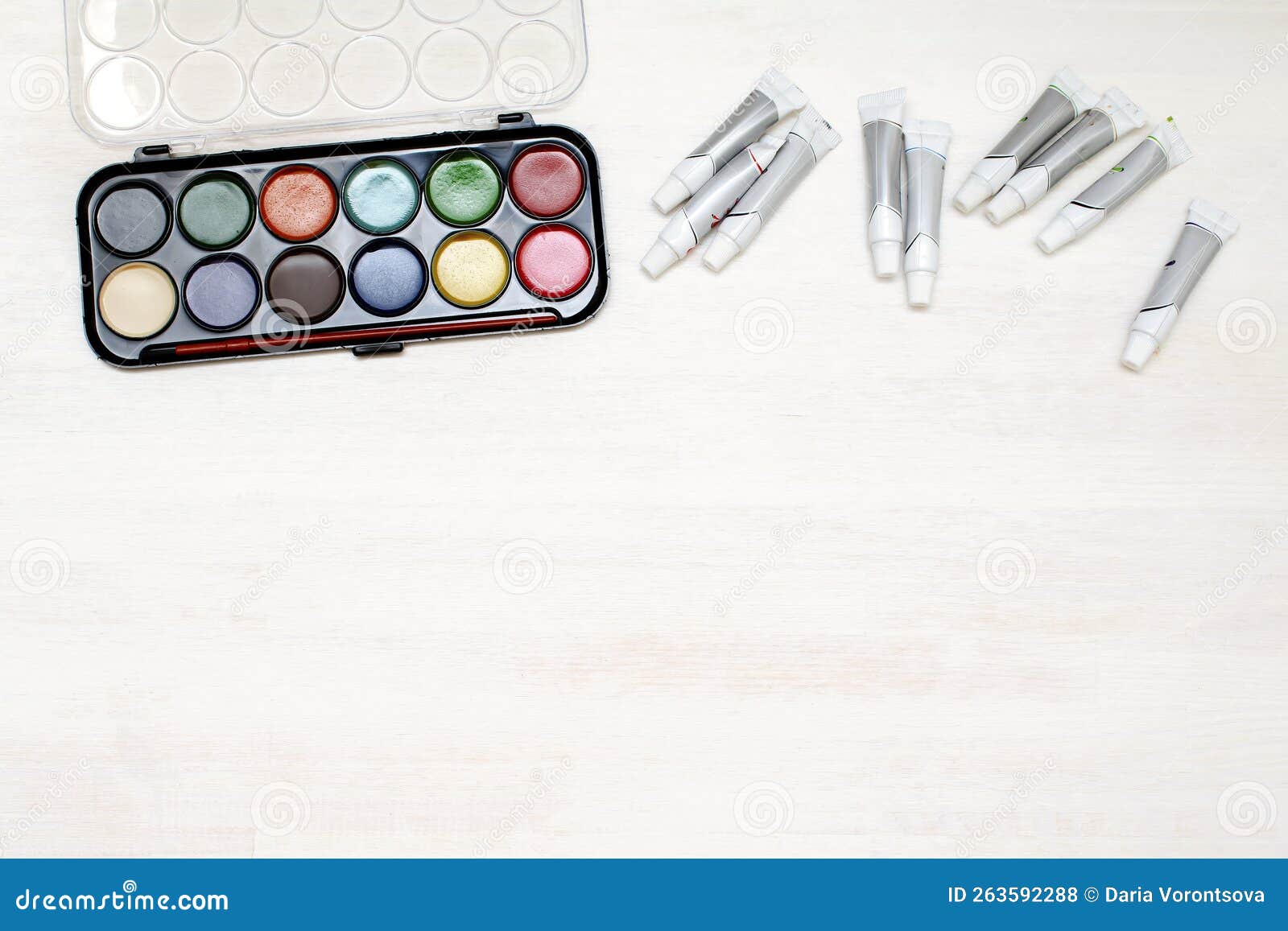 watercolor oil paints in raw. creativity creation process. artist's stuff on white wooden table,blank copy space im